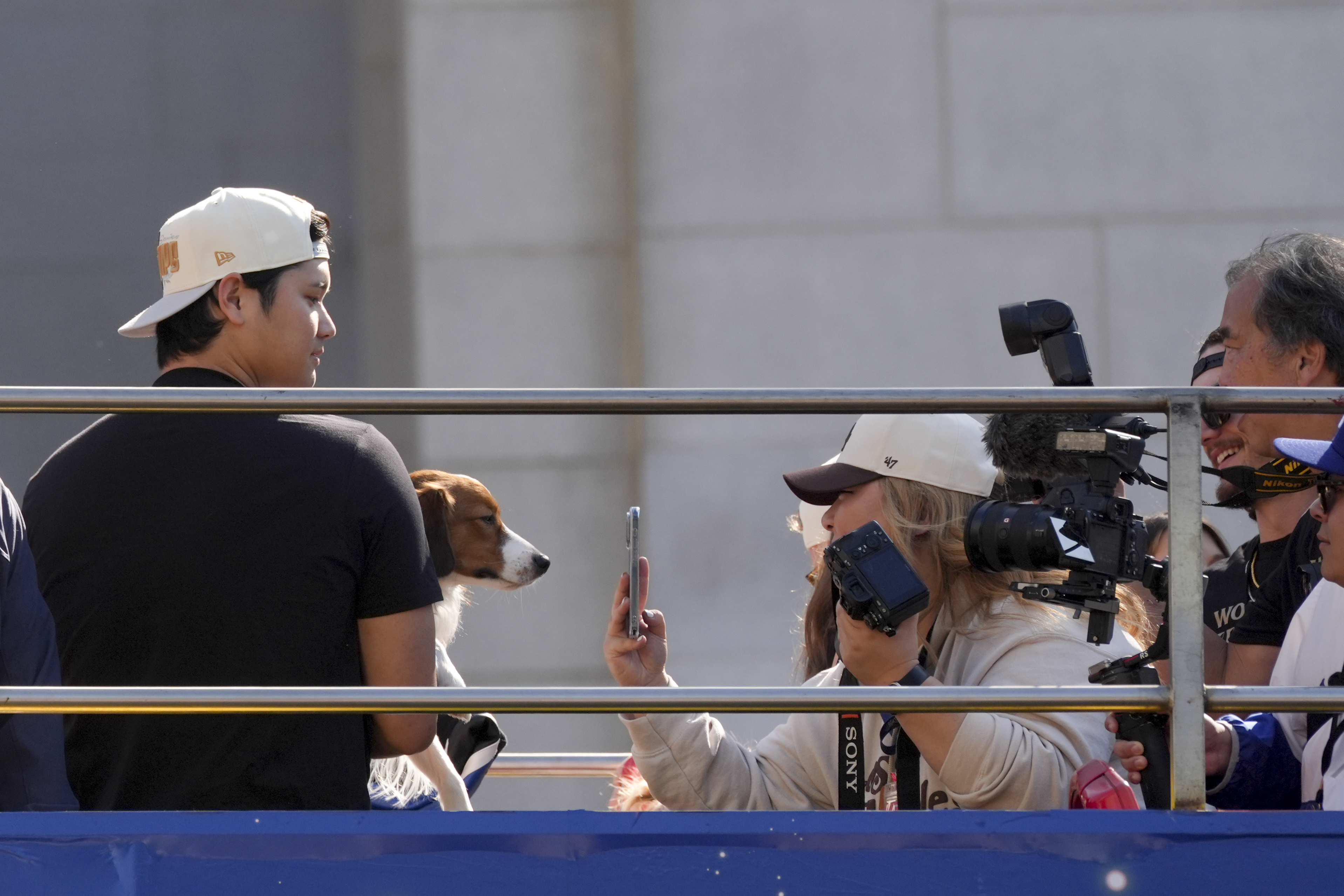 Los Angeles Dodgers' Shohei Ohtani is photographed with his dog Decoy during the Los Angeles Dodgers baseball World Series championship parade Friday, Nov. 1, 2024, in Los Angeles. (AP Photo/Jae C. Hong)