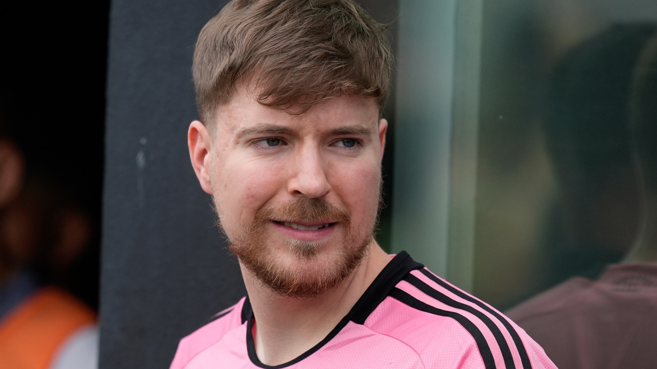 FILE - Jimmy Donaldson, the popular YouTube video maker who goes by MrBeast, wears a Lionel Messi jersey as he stands in a sideline box at the start of an MLS soccer match between Inter Miami and CF Montreal, March 10, 2024, in Fort Lauderdale, Fla. (AP Photo/Rebecca Blackwell, File)