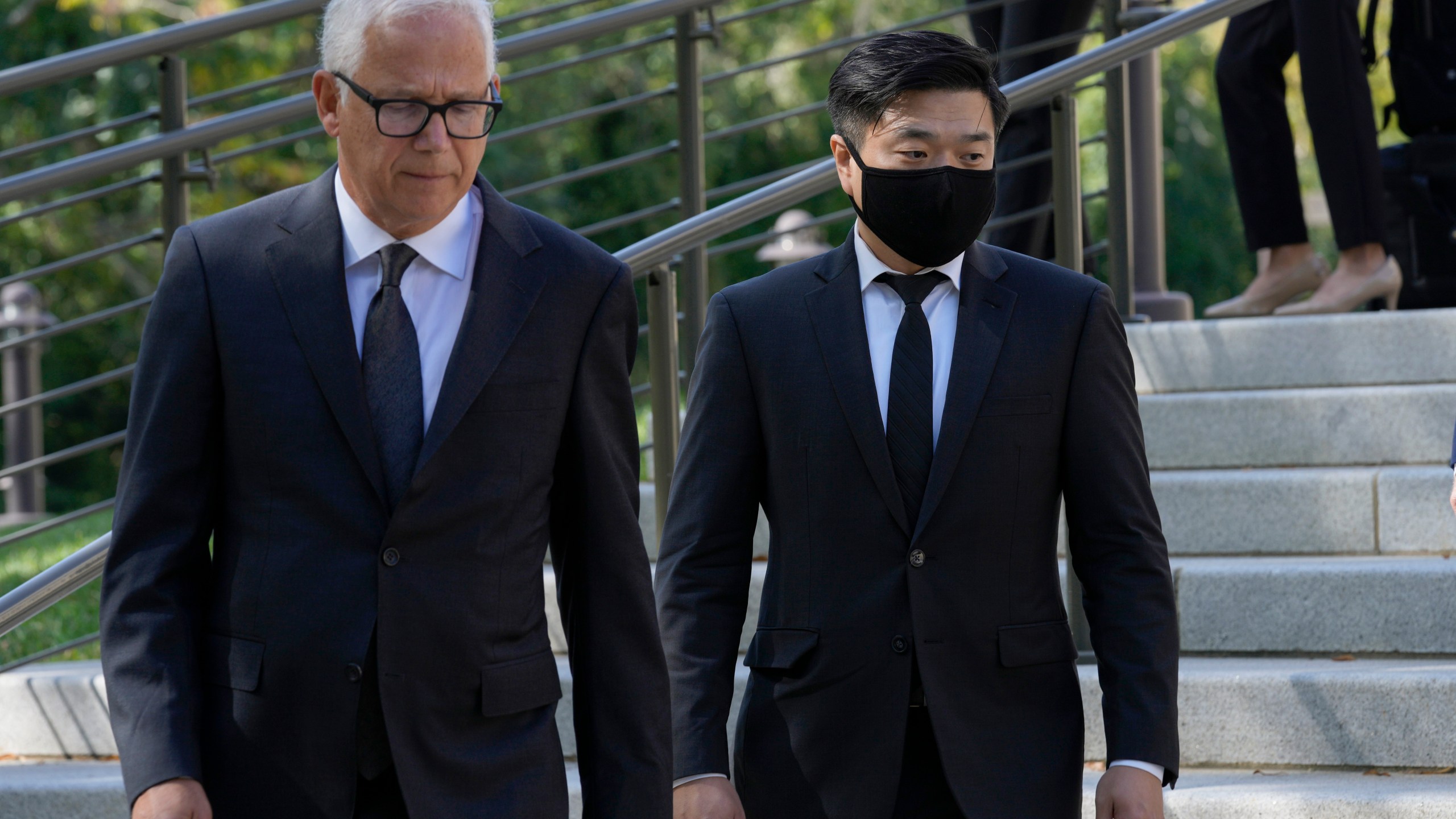 FILE - Attorney David Sanford, left, and Young Lee, right, brother of murder victim Hae Min Lee, walk over to talk with reporters outside Maryland's Supreme Court in Annapolis, Md., Oct. 5, 2023, following arguments in an appeal by Adnan Syed, whose conviction for killing his ex-girlfriend Hae Min Lee more than 20 years ago was chronicled in the hit podcast "Serial." (AP Photo/Susan Walsh, File)