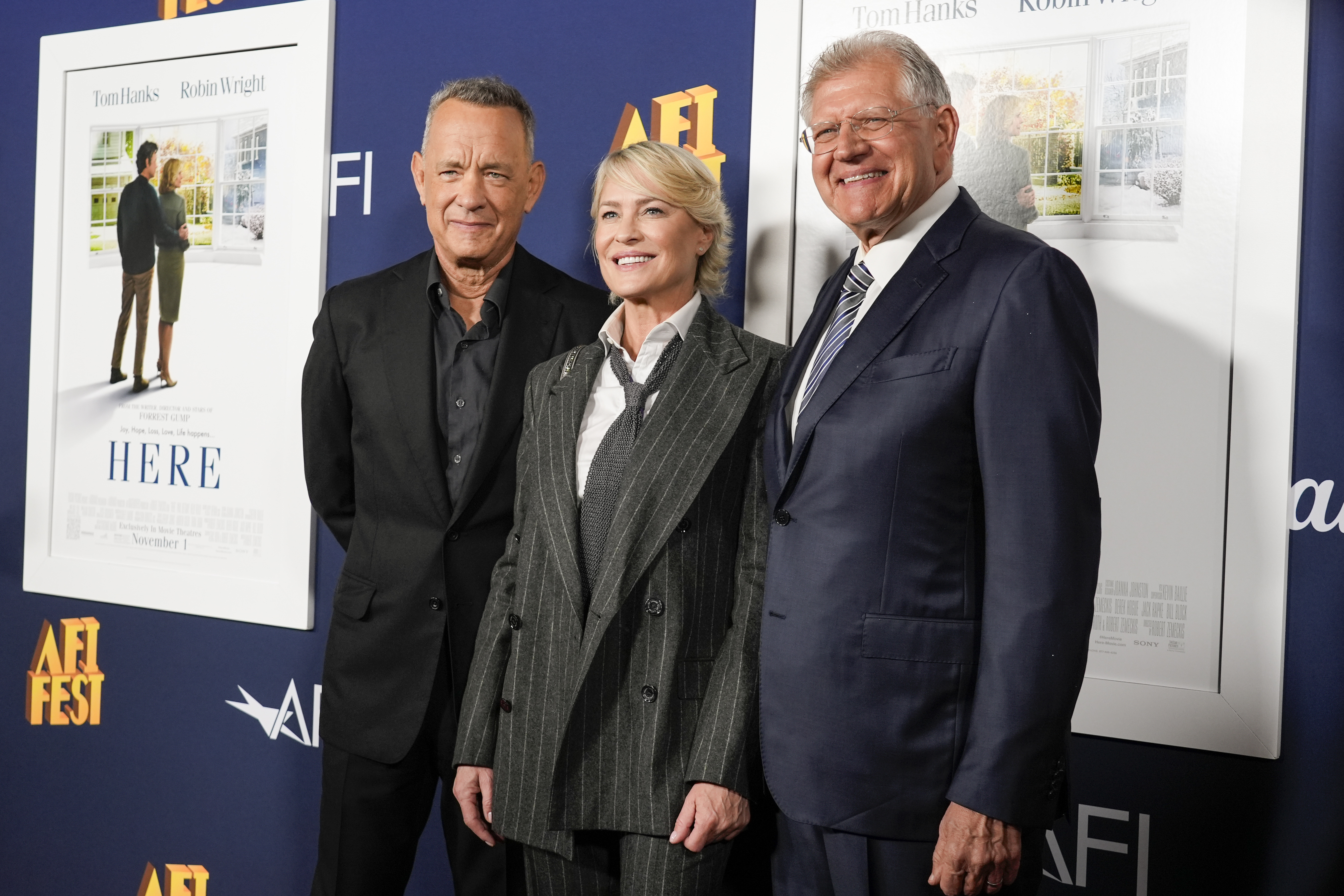 Tom Hanks, from left, Robin Wright, and Robert Zemeckis arrive at the AFI Fest premiere of "Here" on Friday, Oct. 25, 2024, at TCL Chinese Theatre in Los Angeles. (AP Photo/Chris Pizzello)