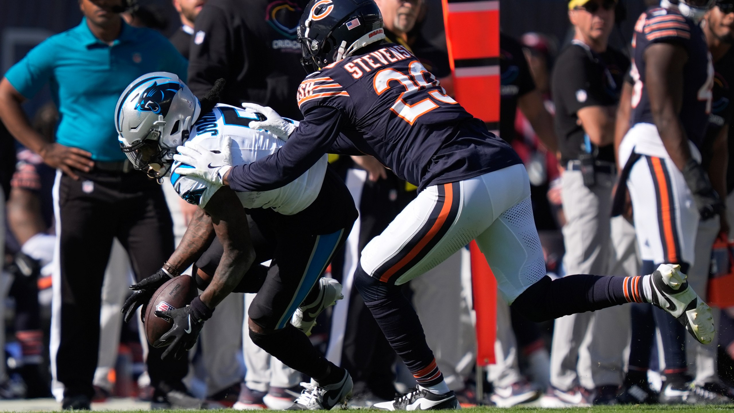 Carolina Panthers wide receiver Diontae Johnson (5) pulls in a reception as Chicago Bears cornerback Tyrique Stevenson (29) defends during the second half of an NFL football game Sunday, Oct. 6, 2024, in Chicago. (AP Photo/Charles Rex Arbogast)