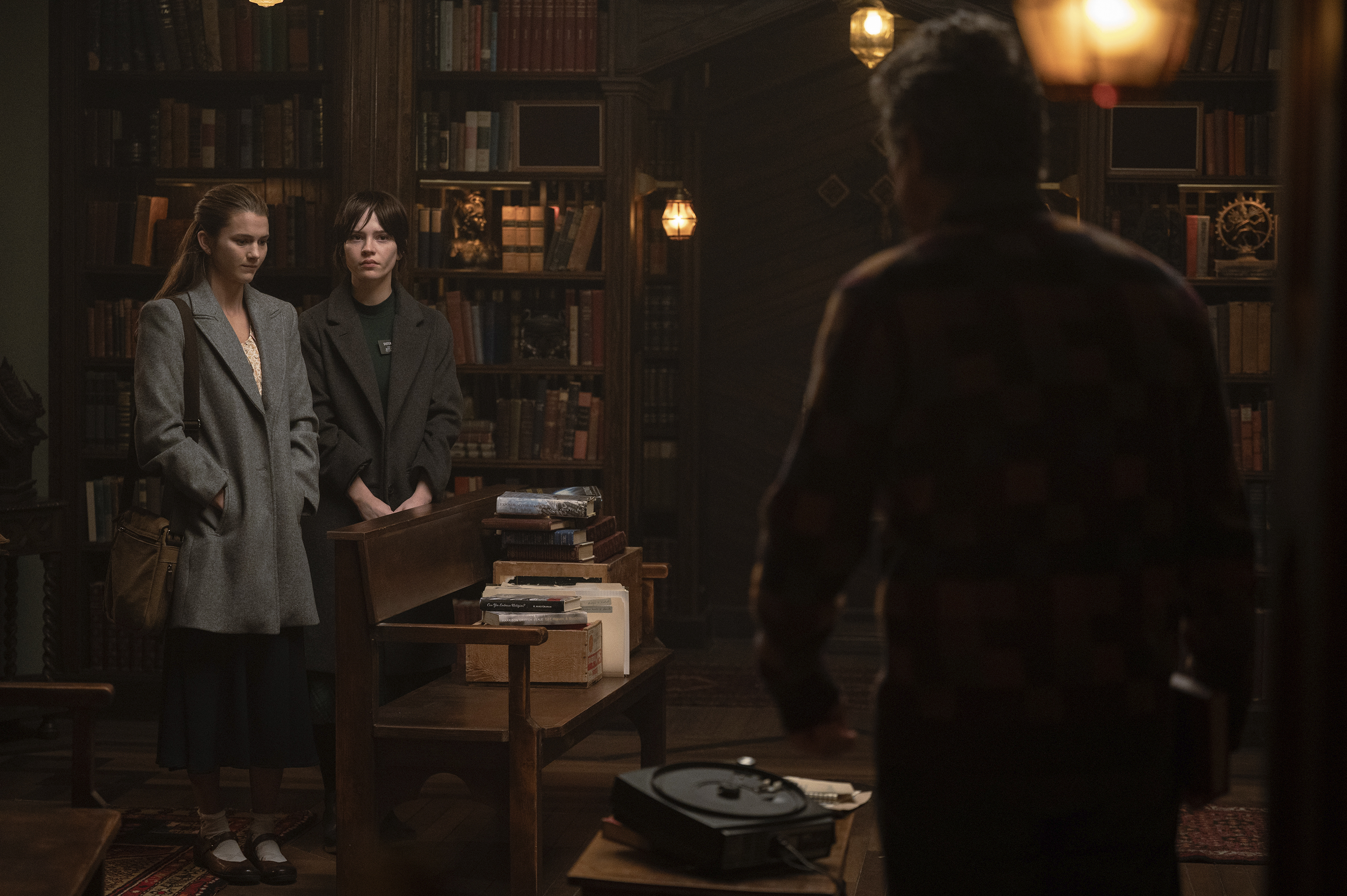 This image released by A24 shows, from left, Chloe East, Sophie Thatcher, and Hugh Grant in a scene from "Heretic." (Kimberley French/A24 via AP)