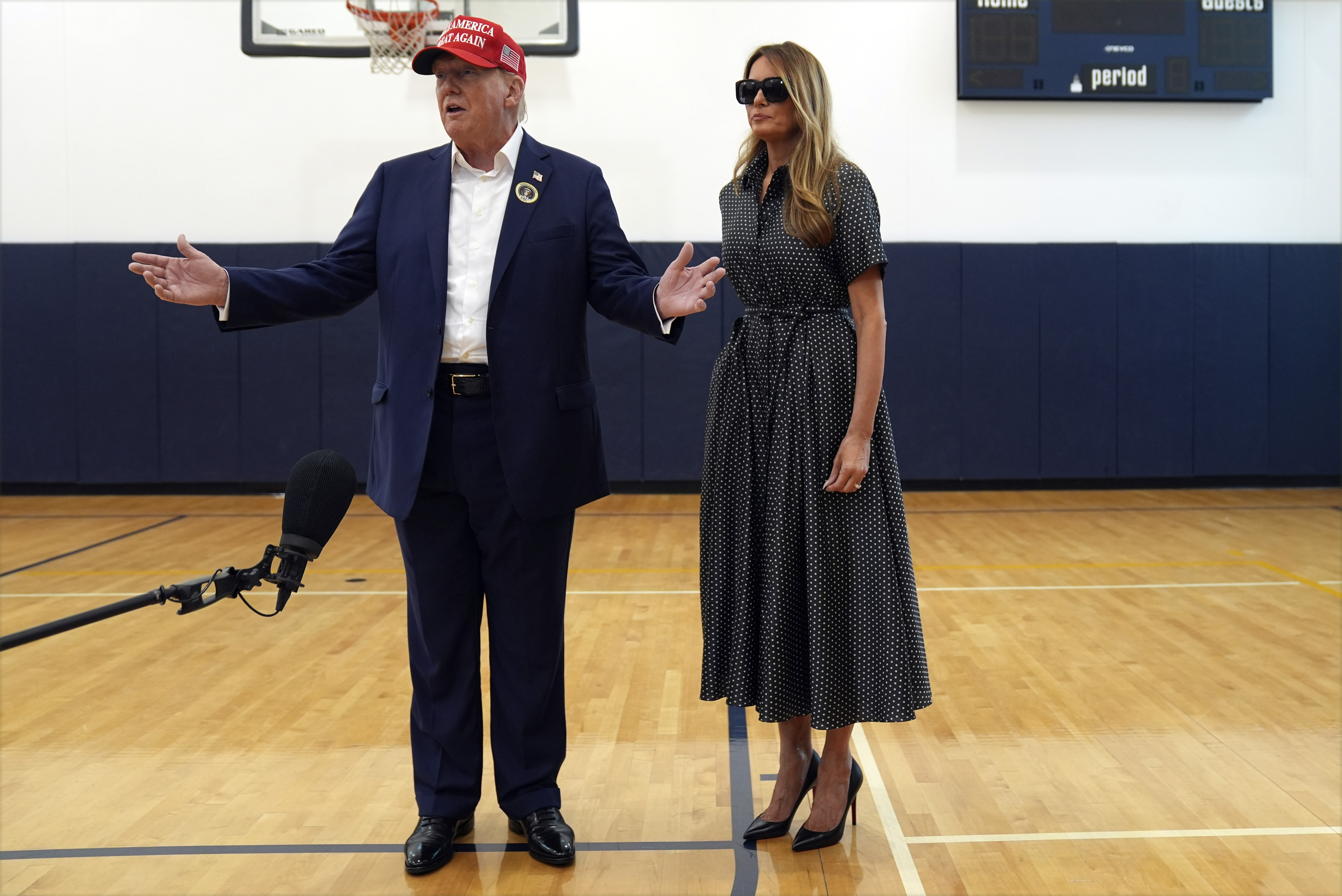 Republican presidential nominee former President Donald Trump speaks as former first lady Melania Trump listens after they voted on Election Day at the Morton and Barbara Mandel Recreation Center, Tuesday, Nov. 5, 2024, in Palm Beach, Fla. (AP Photo/Evan Vucci)