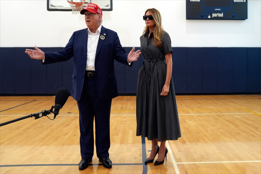 Republican presidential nominee former President Donald Trump speaks as former first lady Melania Trump listens after they voted on Election Day at the Morton and Barbara Mandel Recreation Center, Tuesday, Nov. 5, 2024, in Palm Beach, Fla. (AP Photo/Evan Vucci)