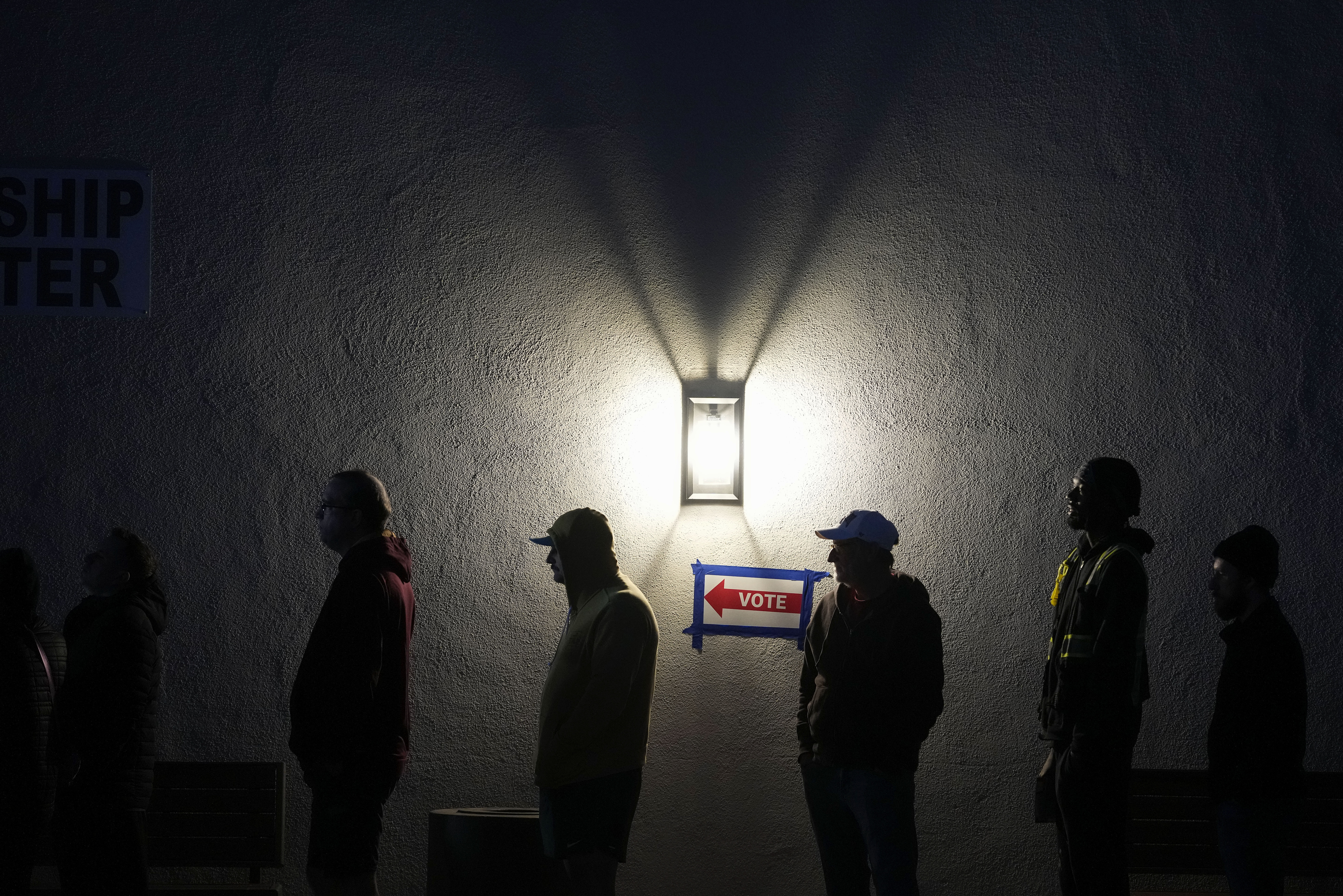 Voters stand in line outside a polling place at Madison Church, Tuesday, Nov. 5, 2024, in Phoenix, Ariz. (AP Photo/Matt York)