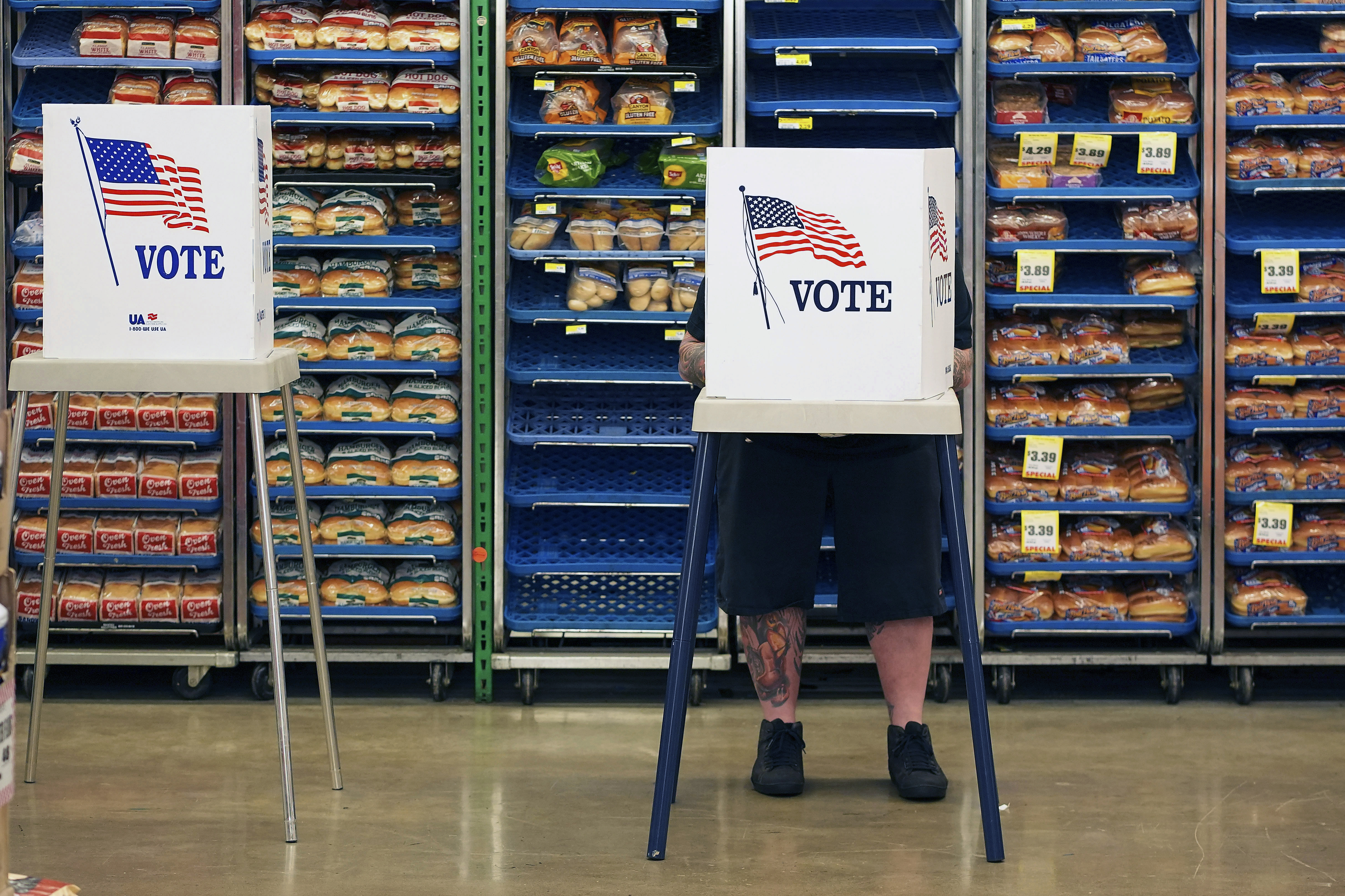 Steven Vandenburgh votes at a grocery store, Tuesday, Nov. 5, 2024, in Lawrence, Kan. (AP Photo/Charlie Riedel)