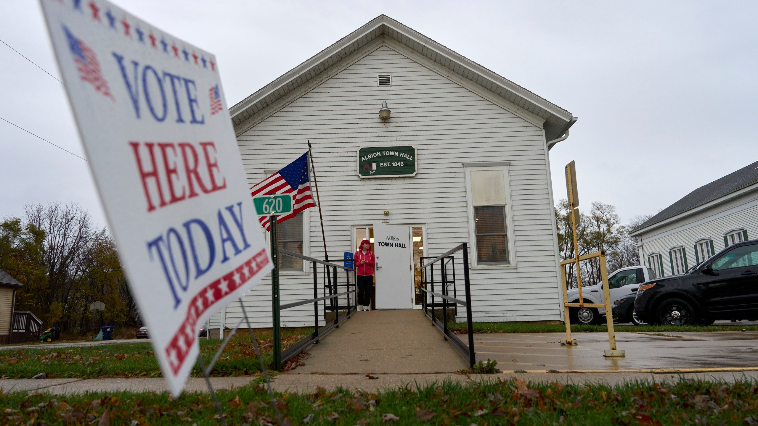 A voter leaves Albion Town hall after casting their ballot on Election Day, Tuesday, Nov. 5, 2024, in Albion, Wis. (AP Photo/Kayla Wolf)