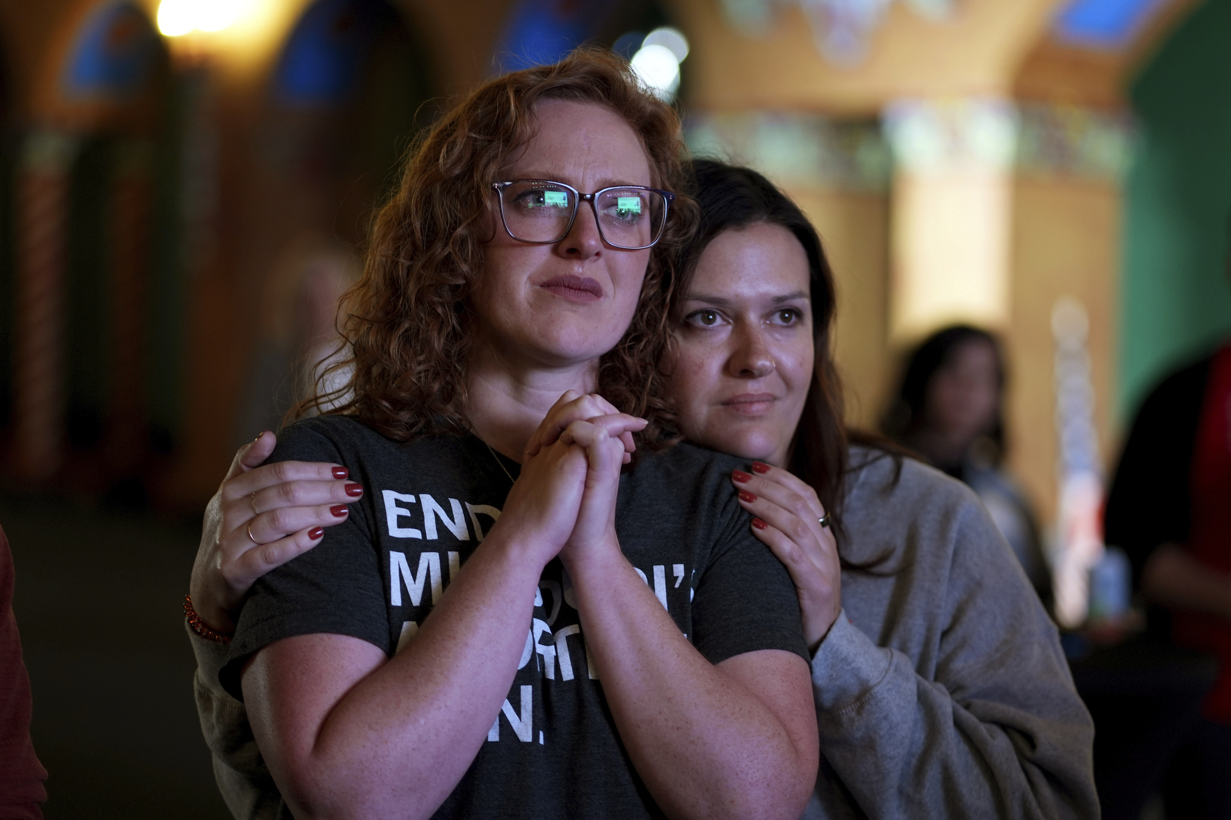 People giving there first names Erika, left, and Leeann react after an abortion rights amendment to the Missouri constitution passed, Tuesday, Nov. 5, 2024, at a watch party in Kansas City, Mo. (AP Photo/Charlie Riedel)