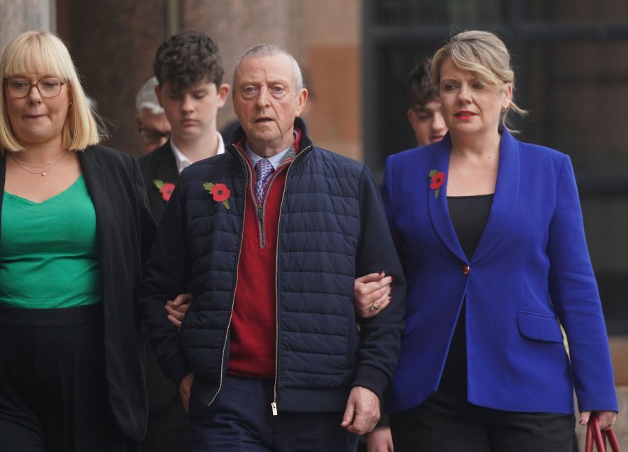 Patrick O'Hara, center, and family members leave Newcastle Crown Court, in Newcastle, England, Wednesday, Nov. 6, 2024 where Dr. Thomas Kwan, was sentenced to 31 years and five months after he attempted to murder Mr O'Hara, who was his mother's partner, with a poisoned fake Covid jab whilst disguised as a nurse. (Owen Humphreys/PA via AP)