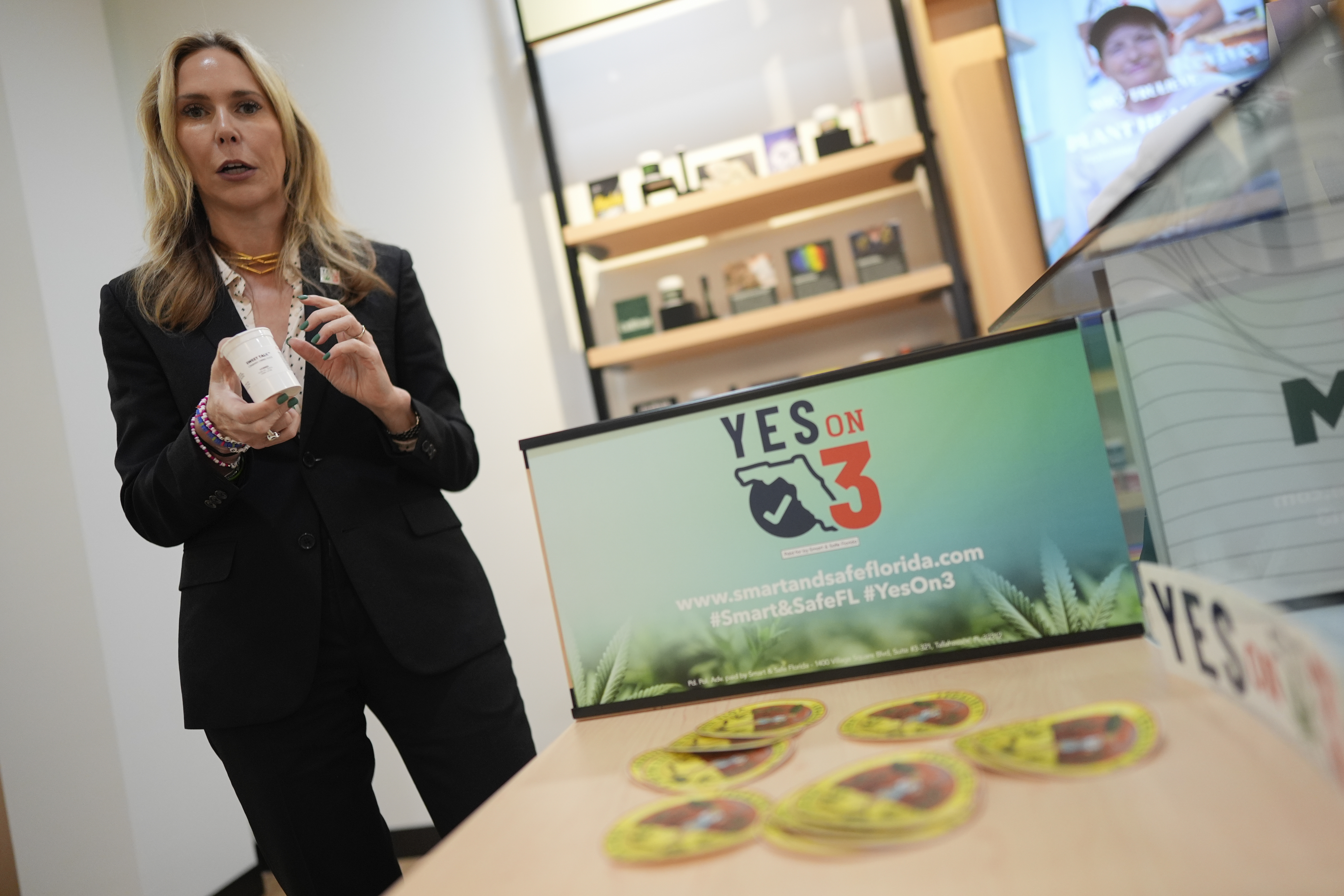 Trulieve CEO Kim Rivers discusses the medical marijuana company's product and packaging safety standards at an event in support of Amendment 3, a ballot initiative which would legalize the recreational use of pot in Florida for adults 21 years old and older, Wednesday, Oct. 23, 2024, at a Trulieve medical cannabis dispensary in Hallendale Beach, Fla. (AP Photo/Rebecca Blackwell)