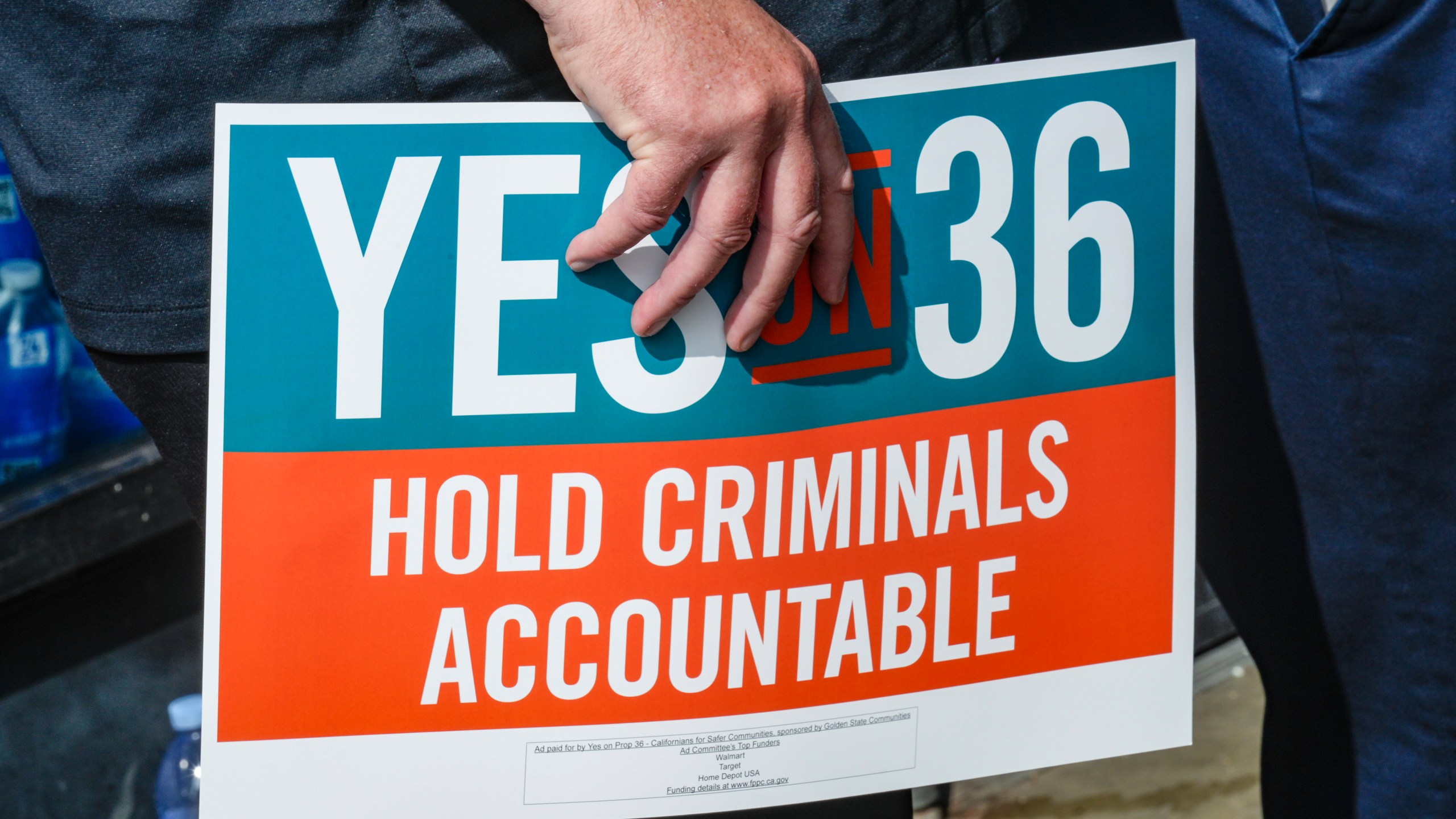 FILE - 7-Eleven leadership and franchisees support the Yes on Prop 36 campaign outside the 7-Eleven that was robbed by about 50 juveniles in late September in Los Angeles during a news conference, Thursday, Oct. 10, 2024. (AP Photo/Damian Dovarganes,File)