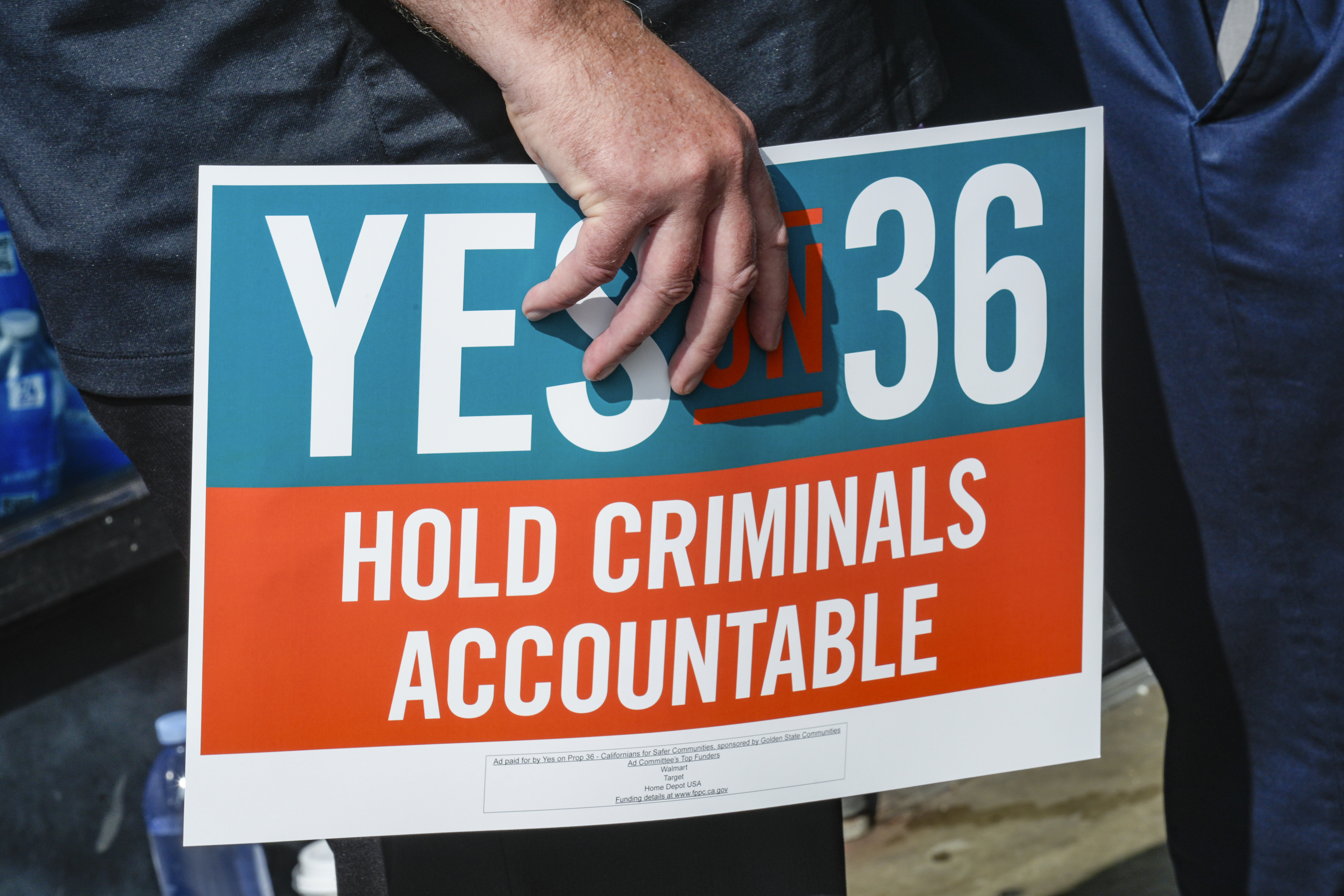 FILE - 7-Eleven leadership and franchisees support the Yes on Prop 36 campaign outside the 7-Eleven that was robbed by about 50 juveniles in late September in Los Angeles during a news conference, Thursday, Oct. 10, 2024. (AP Photo/Damian Dovarganes,File)