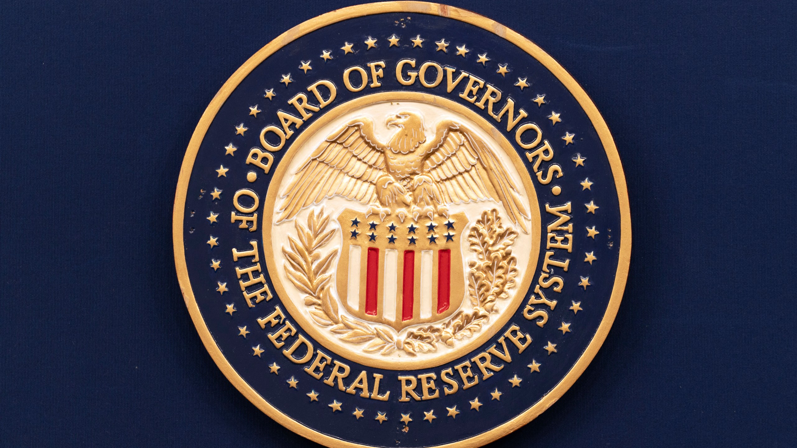 FILE - The seal of The Federal Reserve System is seen during a news conference by Federal Reserve Board Chairman Jerome Powell at the Federal Reserve Board Building on July 31, 2024, in Washington. (AP Photo/Jose Luis Magana, File)