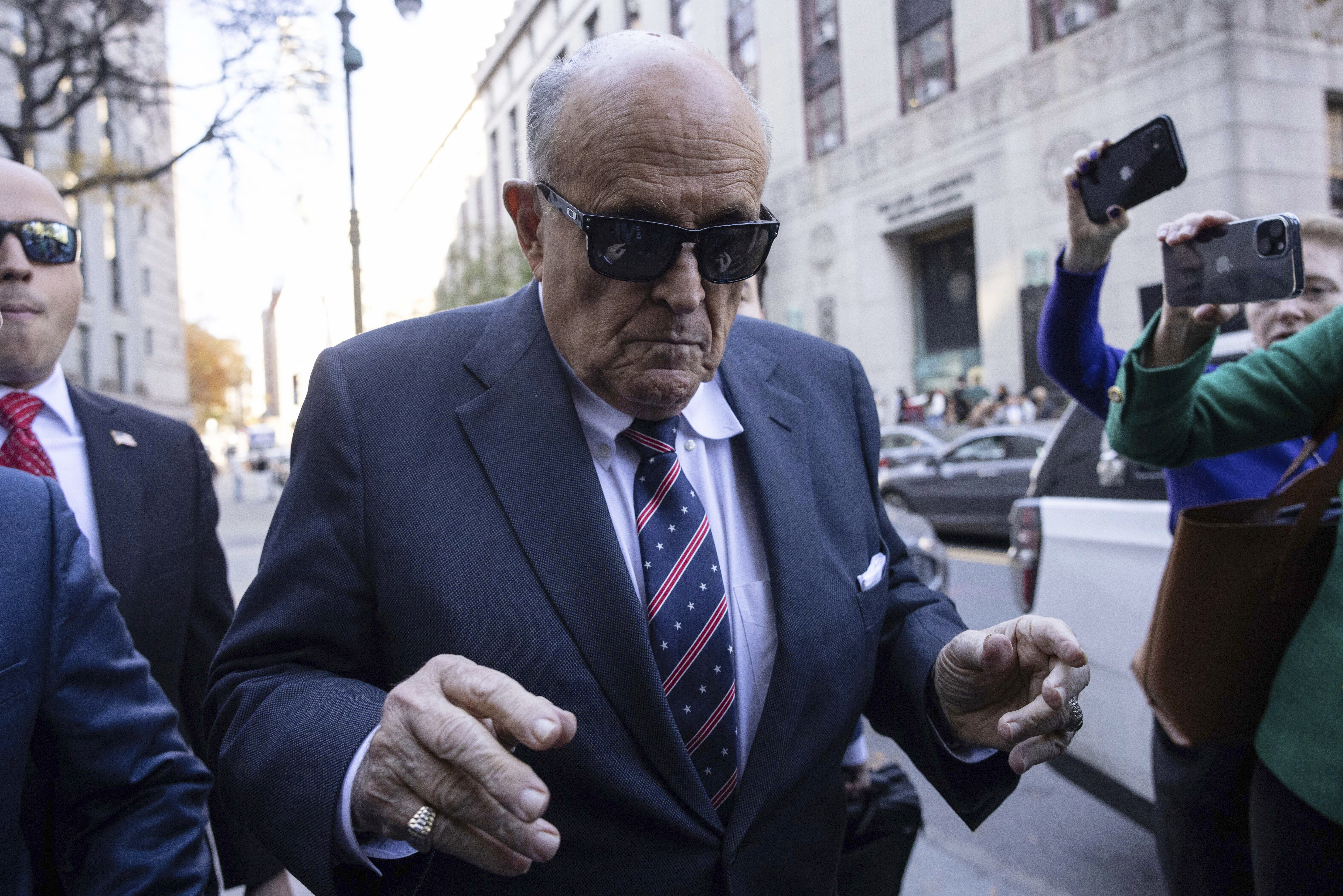 Former New York City Mayor Rudy Giuliani arrives at the court to explain to a federal judge why he hasn't surrendered his valuables as part of a $148 million defamation judgment, in New York, Thursday, Nov. 7, 2024. (AP Photo/Yuki Iwamura)