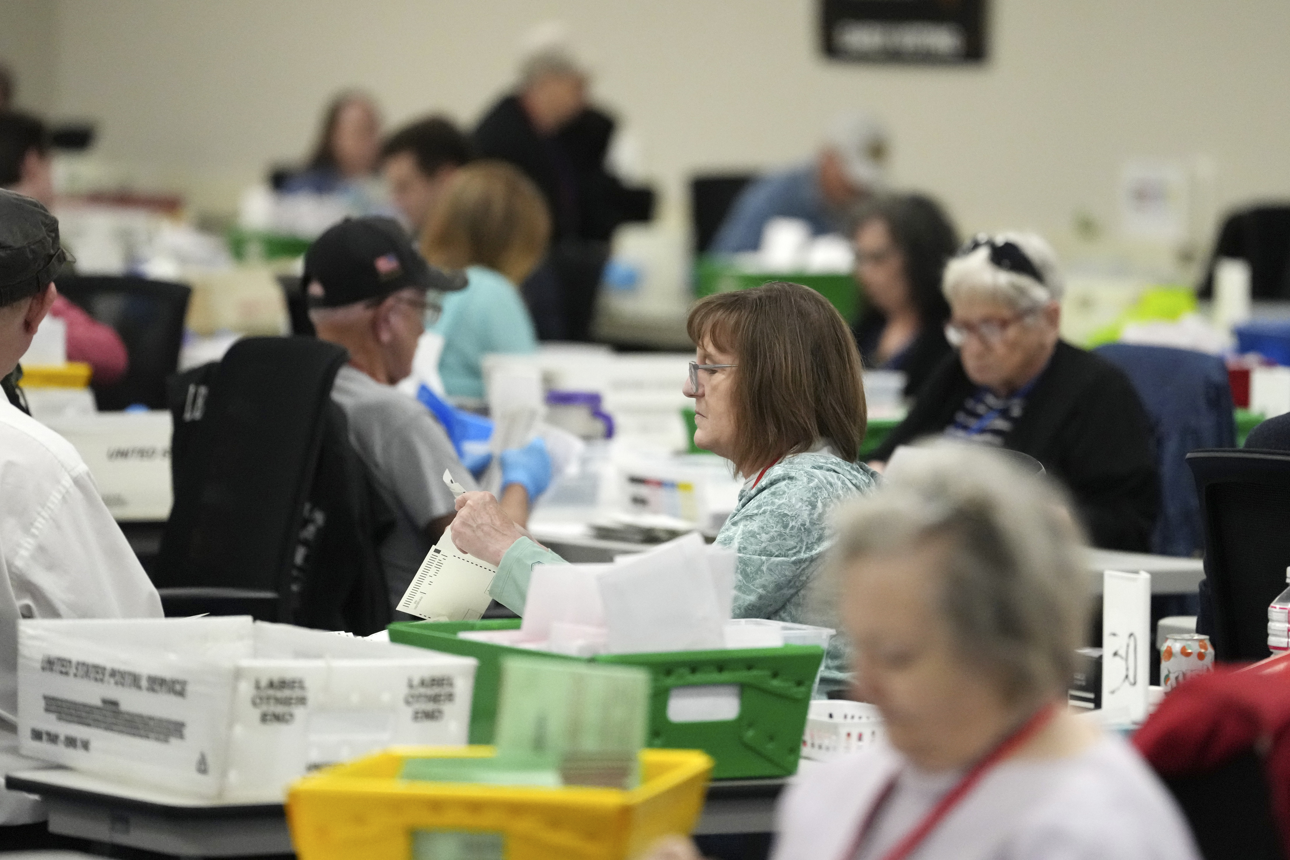 Election workers process ballots at the Maricopa County Tabulation Center Wednesday, Nov. 6, 2024, in Phoenix. (AP Photo/Ross D. Franklin)