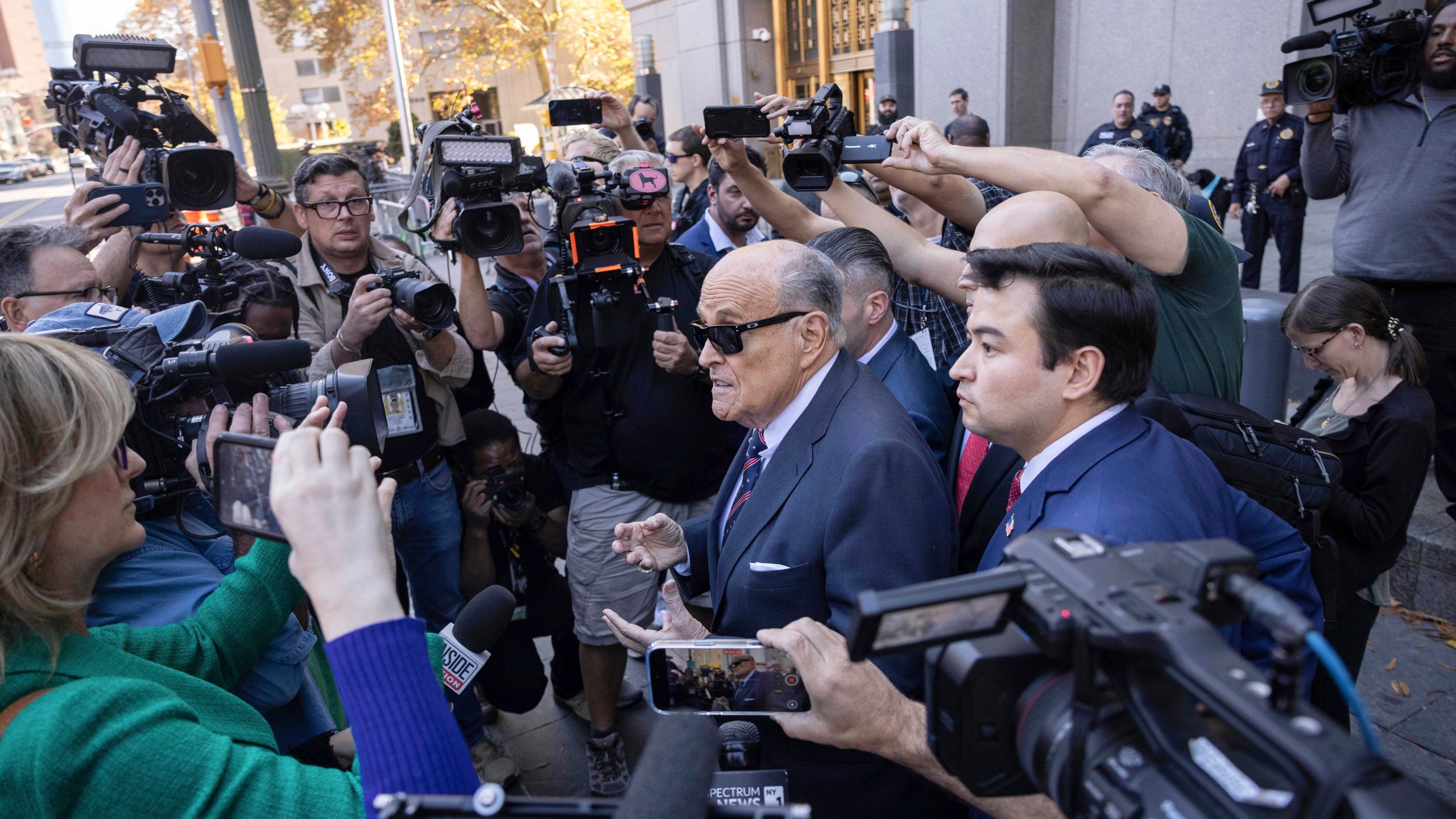 Former New York City Mayor Rudy Giuliani arrives at the court to explain to a federal judge why he hasn't surrendered his valuables as part of a $148 million defamation judgment, in New York, Thursday, Nov. 7, 2024. (AP Photo/Yuki Iwamura)