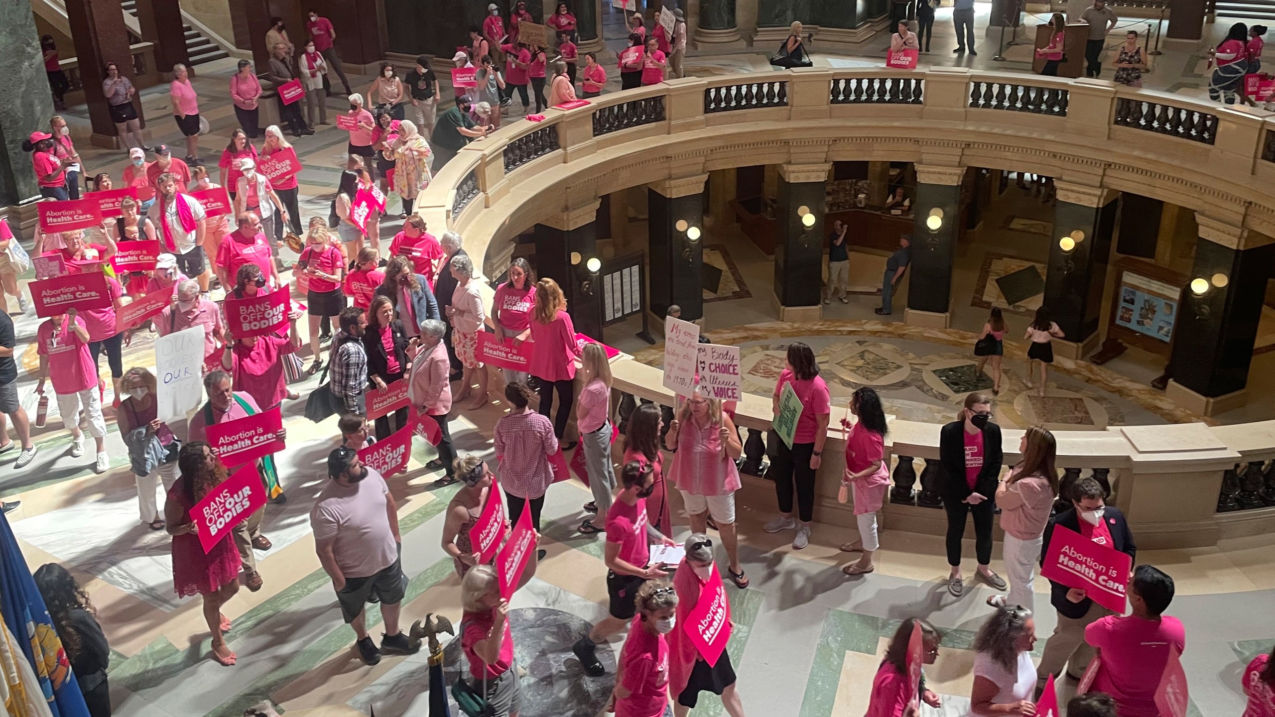 FILE - Abortion rights supporters gather for a "pink out" protest organized by Planned Parenthood in the rotunda of the Wisconsin Capitol, June 22, 2022, in Madison, Wis. (AP Photo/Harm Venhuizen, File)