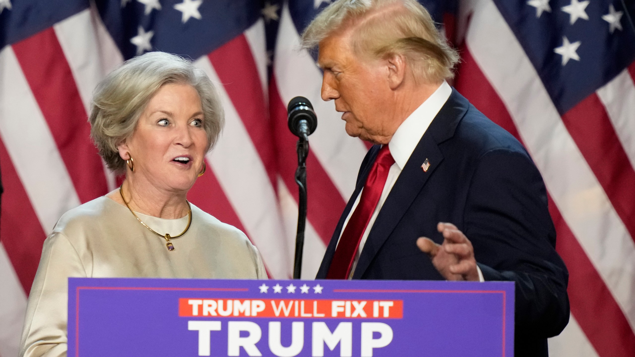 Republican presidential nominee former President Donald Trump brings Susie Wiles to the podium at an election night watch party Wednesday, Nov. 6, 2024, in West Palm Beach, Fla. (AP Photo/Alex Brandon)