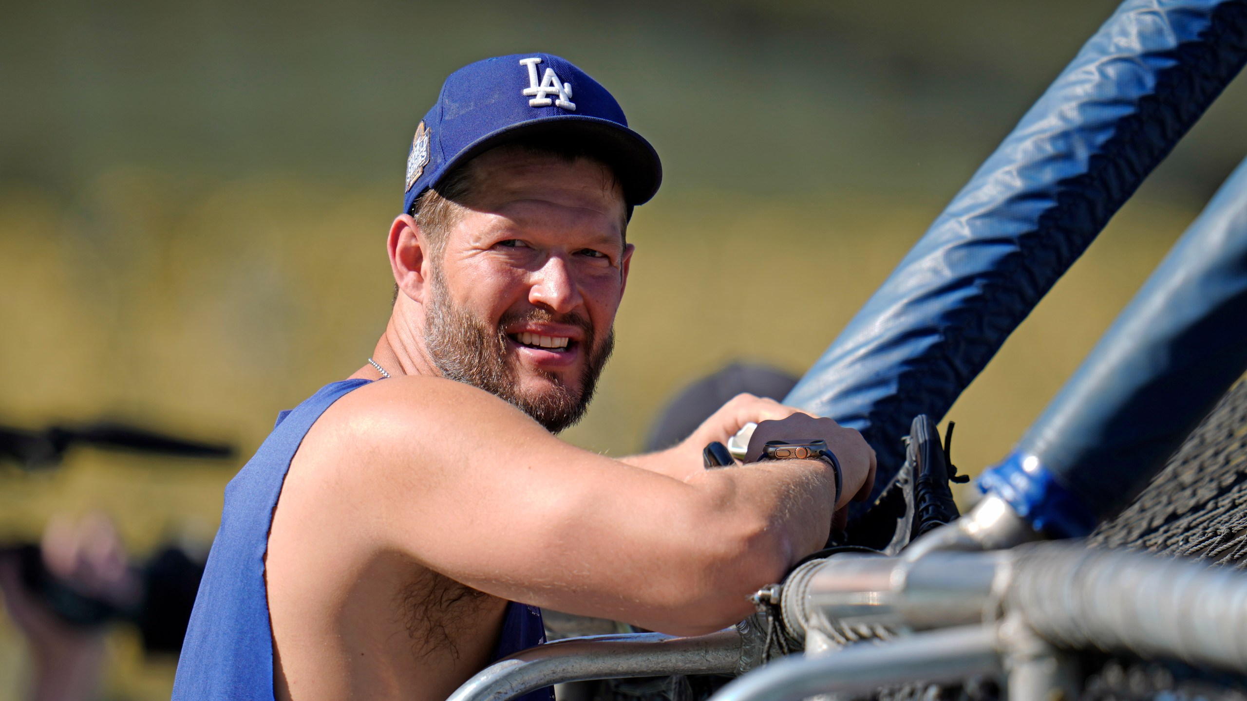 Los Angeles Dodgers pitcher Clayton Kershaw watches batting practice before Game 1 of the baseball World Series against the New York Yankees, Friday, Oct. 25, 2024, in Los Angeles. (AP Photo/Julio Cortez)