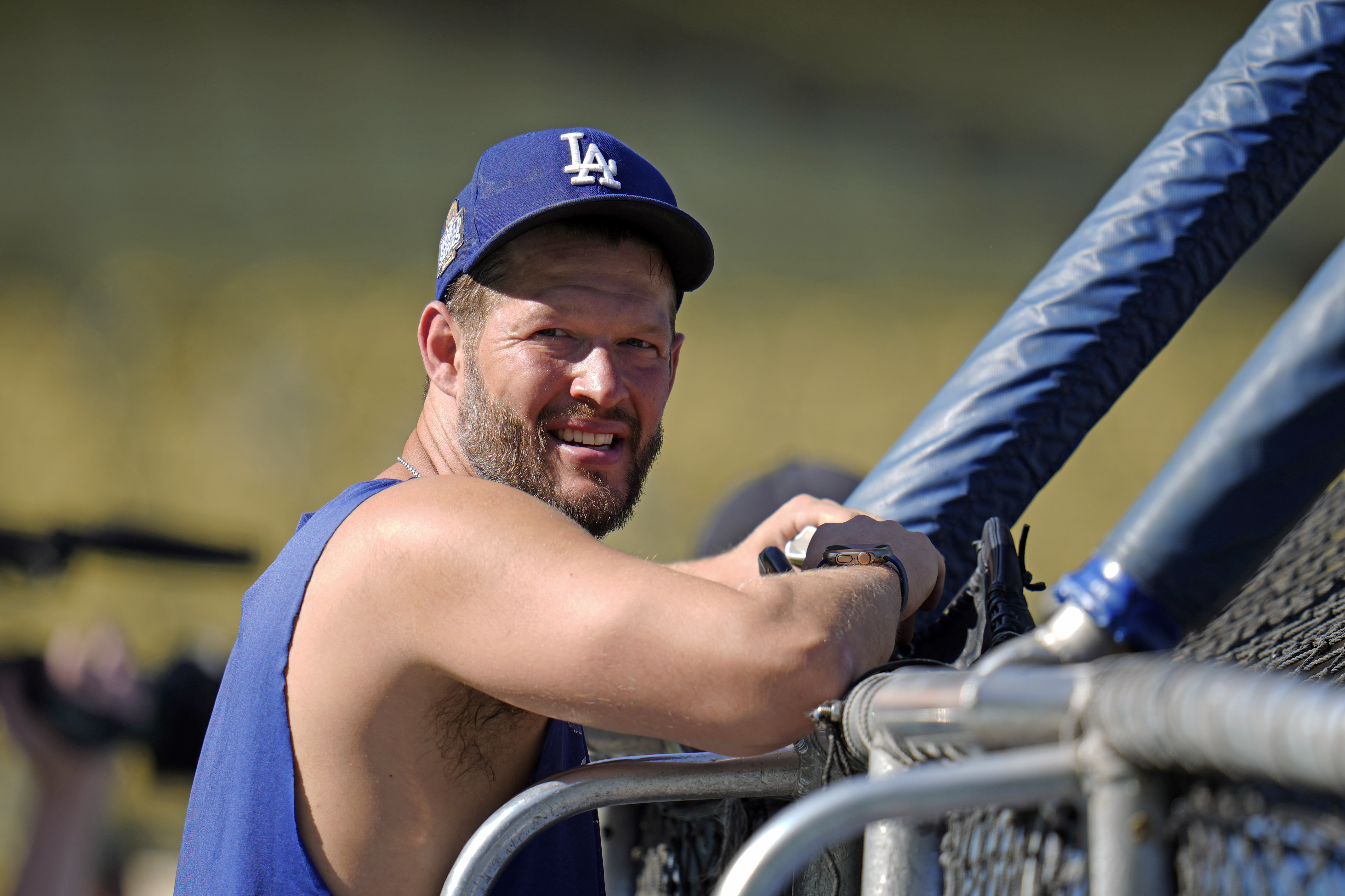 Los Angeles Dodgers pitcher Clayton Kershaw watches batting practice before Game 1 of the baseball World Series against the New York Yankees, Friday, Oct. 25, 2024, in Los Angeles. (AP Photo/Julio Cortez)