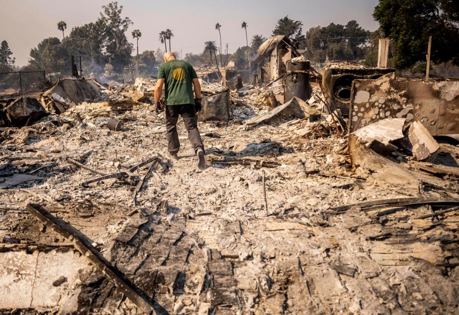 Marvin Meador walks on the remains of his fire-ravaged property after the Mountain Fire swept through, Thursday, Nov. 7, 2024, in Camarillo, Calif. (AP Photo/Ethan Swope)