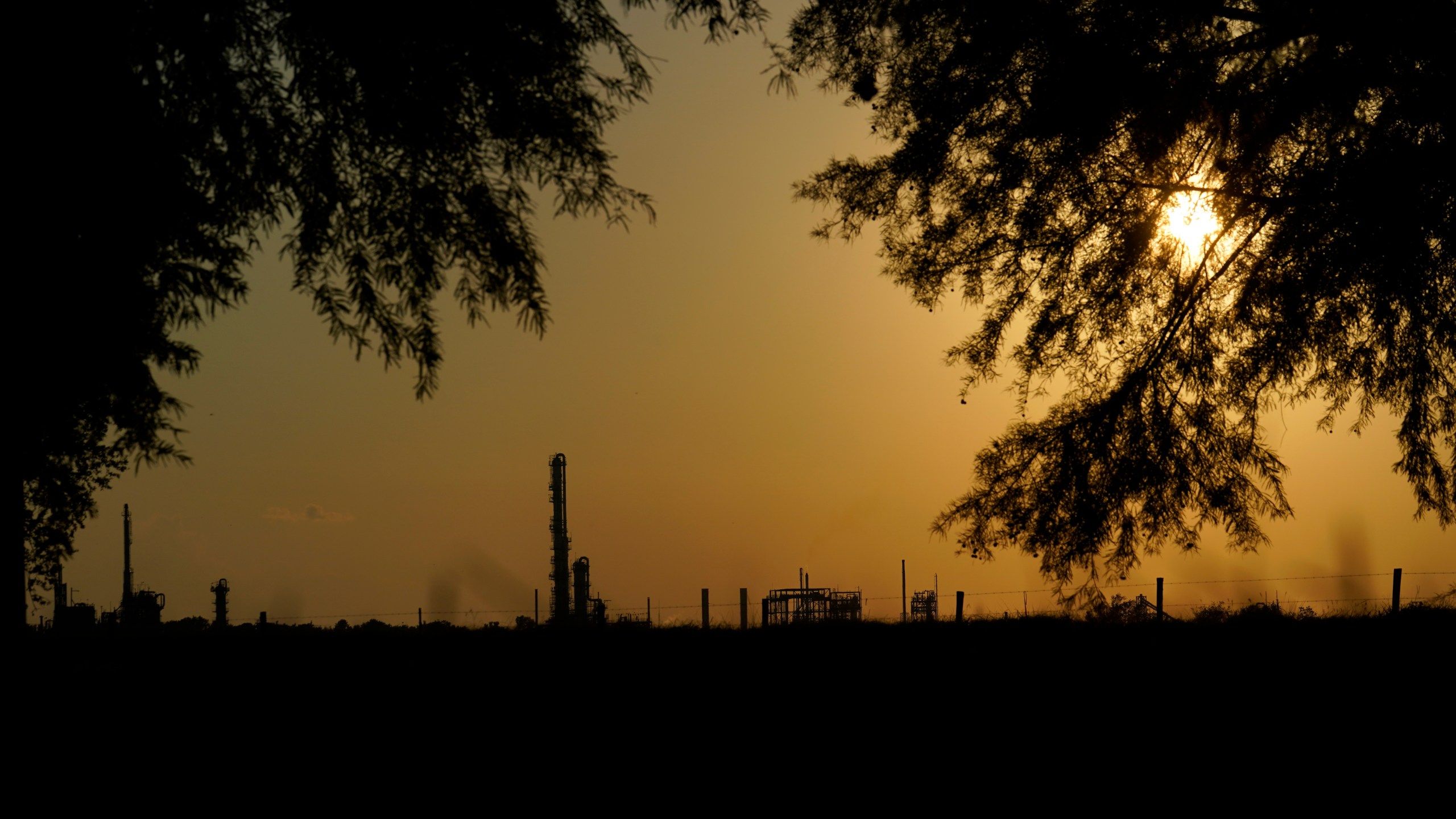 FILE - The Denka Performance Elastomer Plant sits at sunset in Reserve, La., on Sept. 23, 2022. (AP Photo/Gerald Herbert, File)