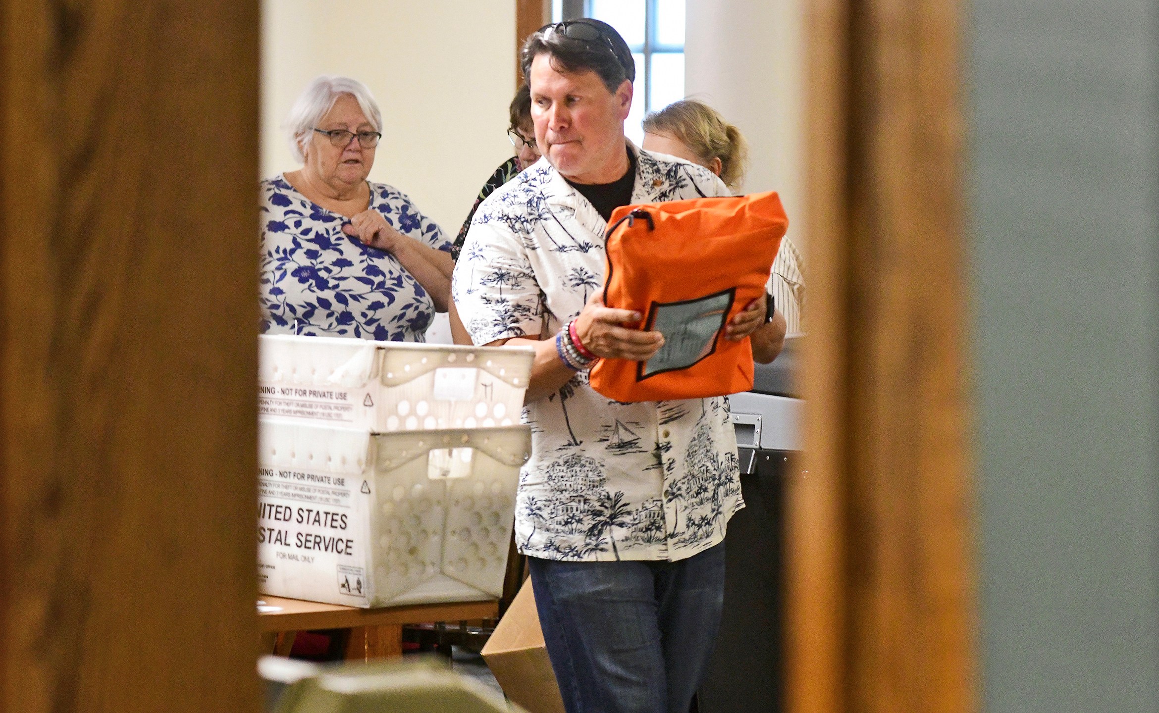 Cambria County election officials work to tally uncounted ballots at the Cambria County Courthouse in Ebensburg, Pa., Wednesday, Nov. 6, 2024. (Thomas Slusser/The Tribune-Democrat via AP)