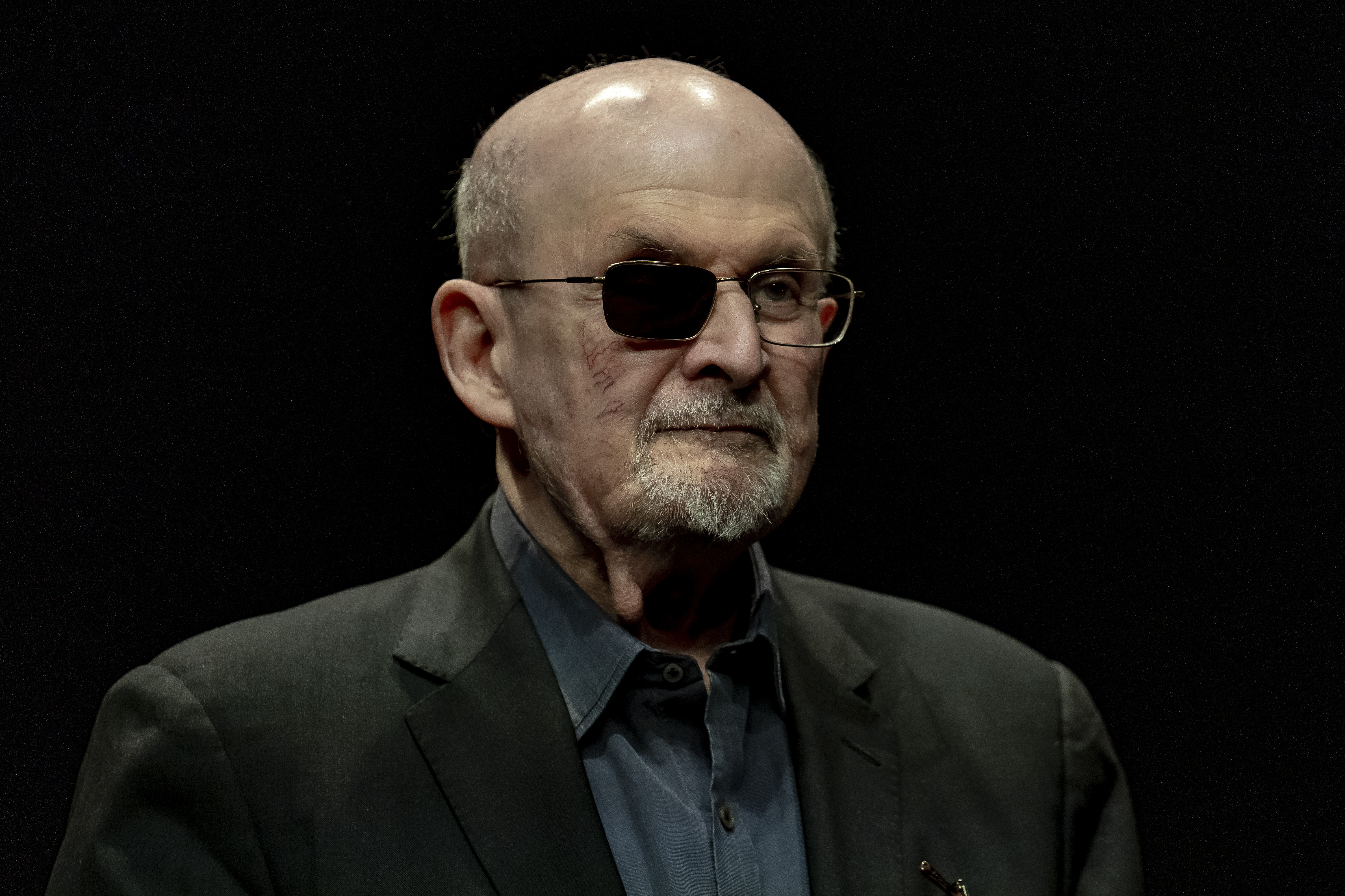 FILE - Salman Rushdie poses for a portrait to promote his book "Knife: Meditations After an Attempted Murder", at the Deutsches Theater in Berlin, Germany, Thursday, May 16, 2024. (AP Photo/Ebrahim Noroozi, File)