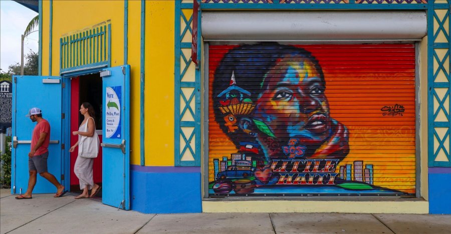 A voter exits the polling station on Election Day at the Little Haiti Cultural Complex's Caribbean Marketplace in Miami's Little Haiti neighborhood Tuesday, Nov. 5, 2024. (Carl Juste//Miami Herald via AP)