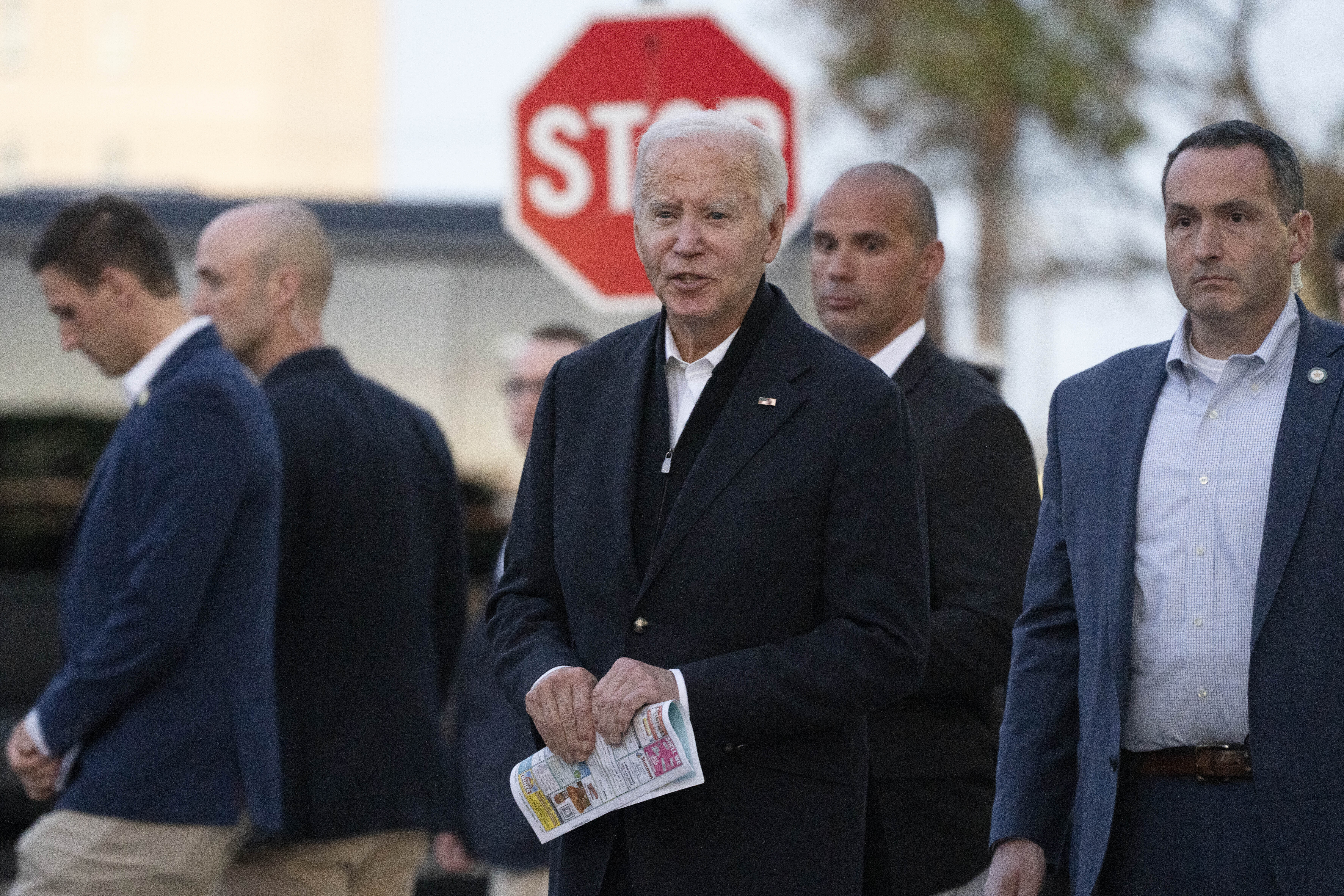 President Joe Biden responds to reporters' questions as he leaves St. Edmond Roman Catholic Church in Rehoboth Beach, Del., after attending mass, Saturday, Nov. 9, 2024. (AP Photo/Manuel Balce Ceneta)