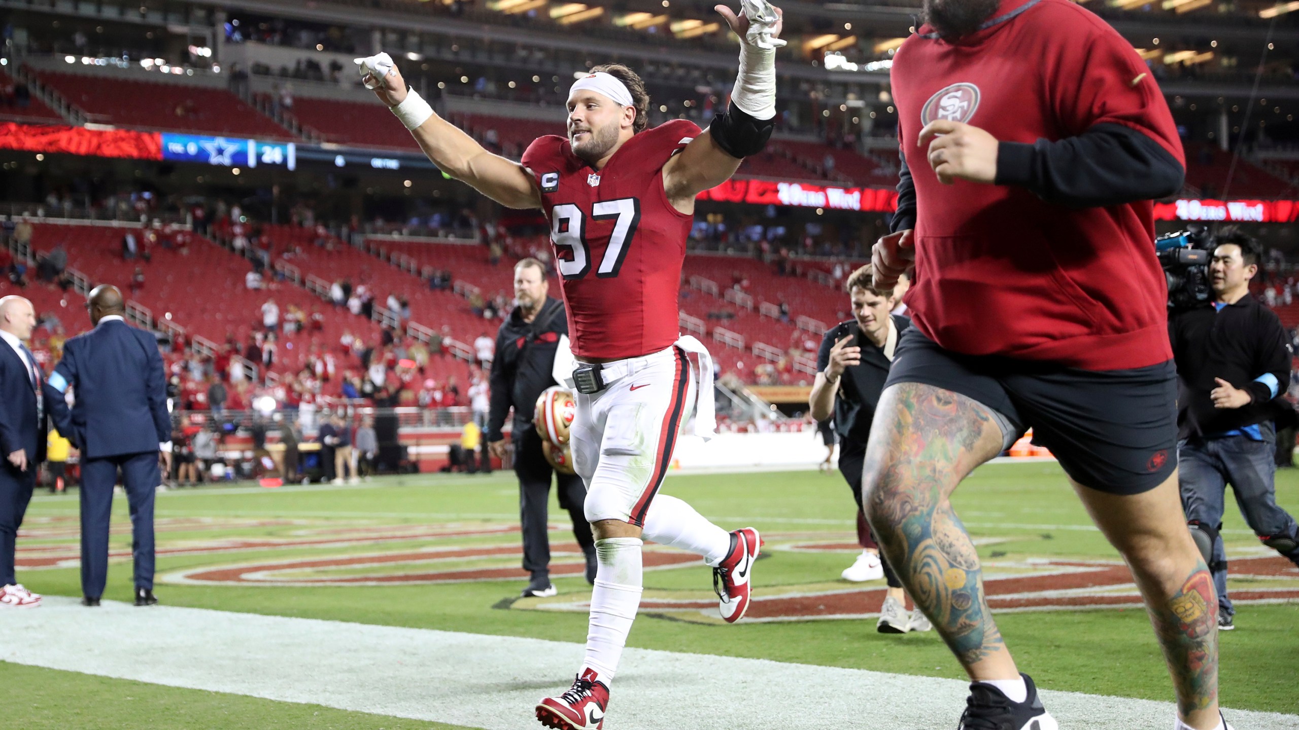 San Francisco 49ers' Nick Bosa runs off the field after the 49ers' win over the Dallas Cowboys in an NFL football game at Levi's Stadium in Santa Clara, Calif., Sunday, Oct. 27, 2024. (Scott Strazzante/San Francisco Chronicle via AP)