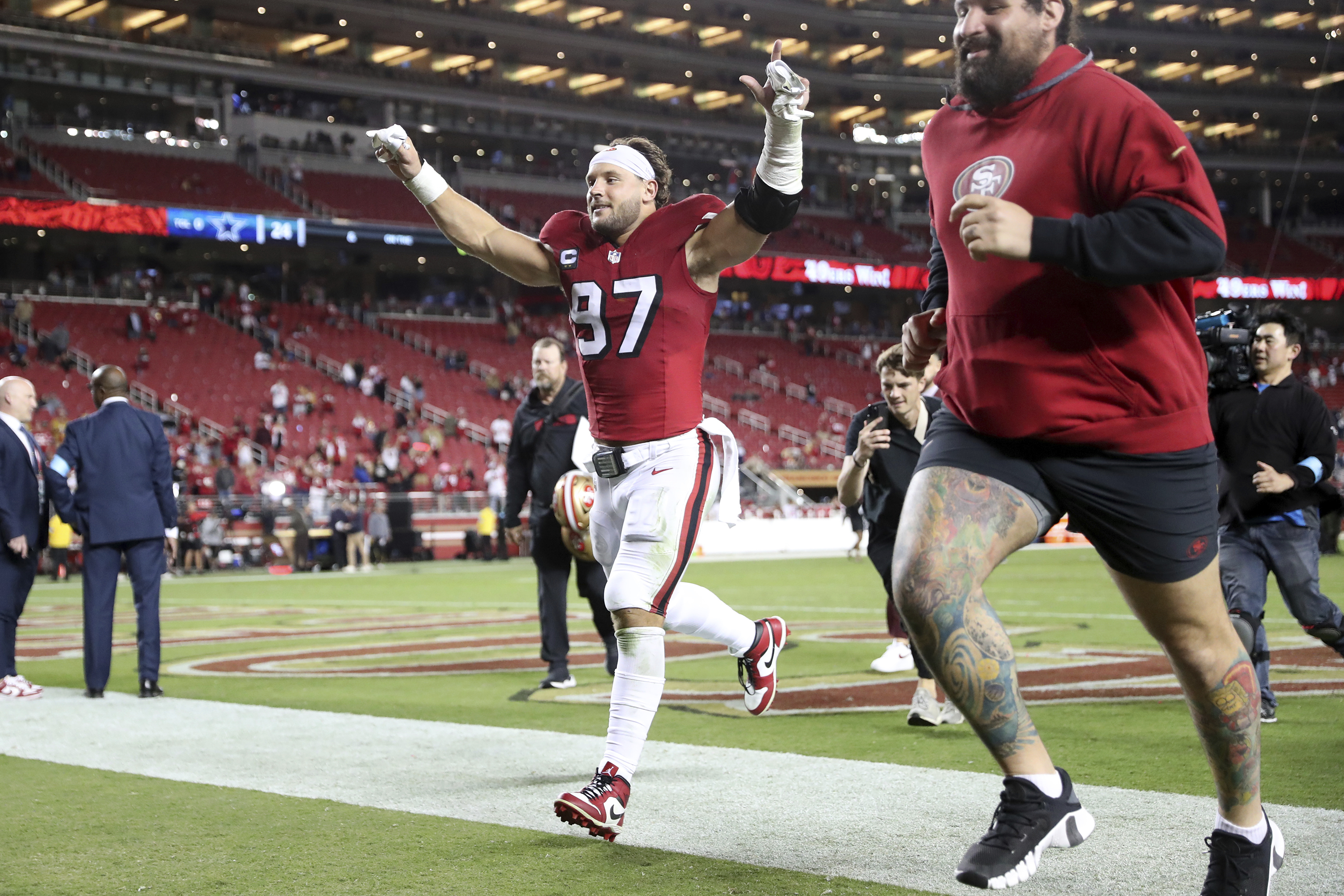 San Francisco 49ers' Nick Bosa runs off the field after the 49ers' win over the Dallas Cowboys in an NFL football game at Levi's Stadium in Santa Clara, Calif., Sunday, Oct. 27, 2024. (Scott Strazzante/San Francisco Chronicle via AP)