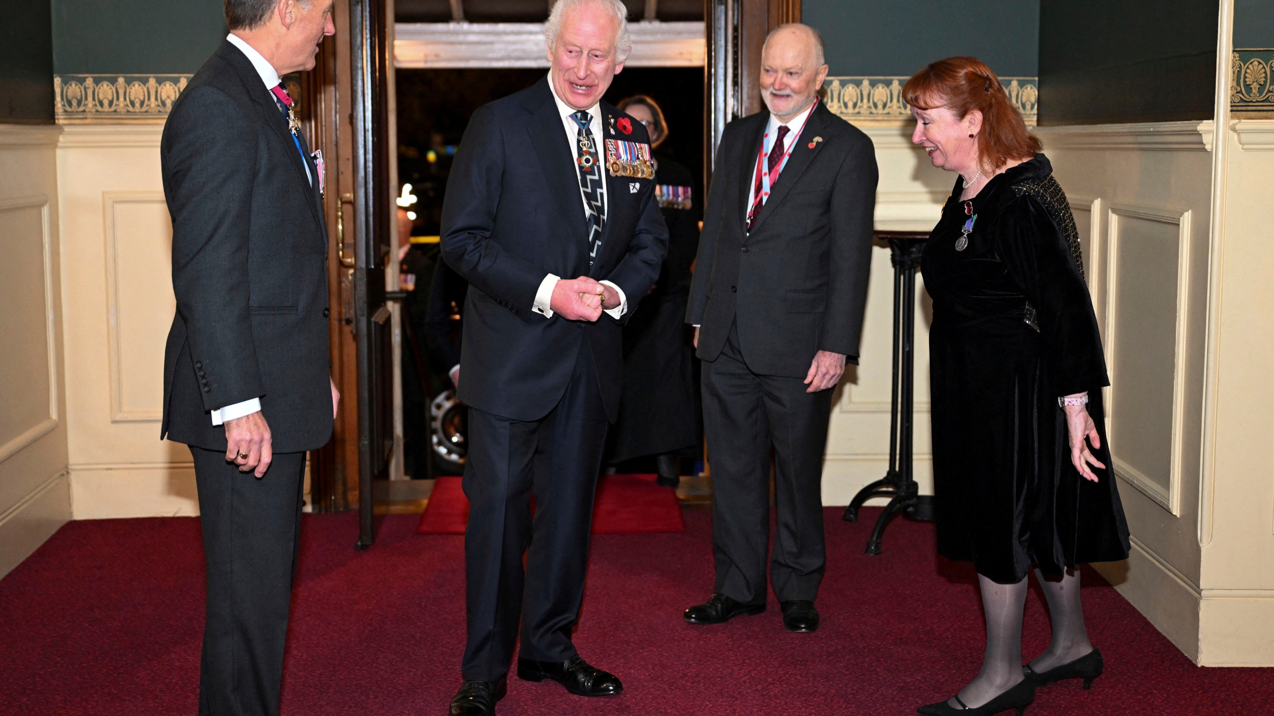 Britain's King Charles, centre left, arrives to attend the Royal British Legion Festival of Remembrance at the Royal Albert Hall in London, Saturday Nov. 9, 2024. (Chris J. Ratcliffe/Pool Photo via AP)