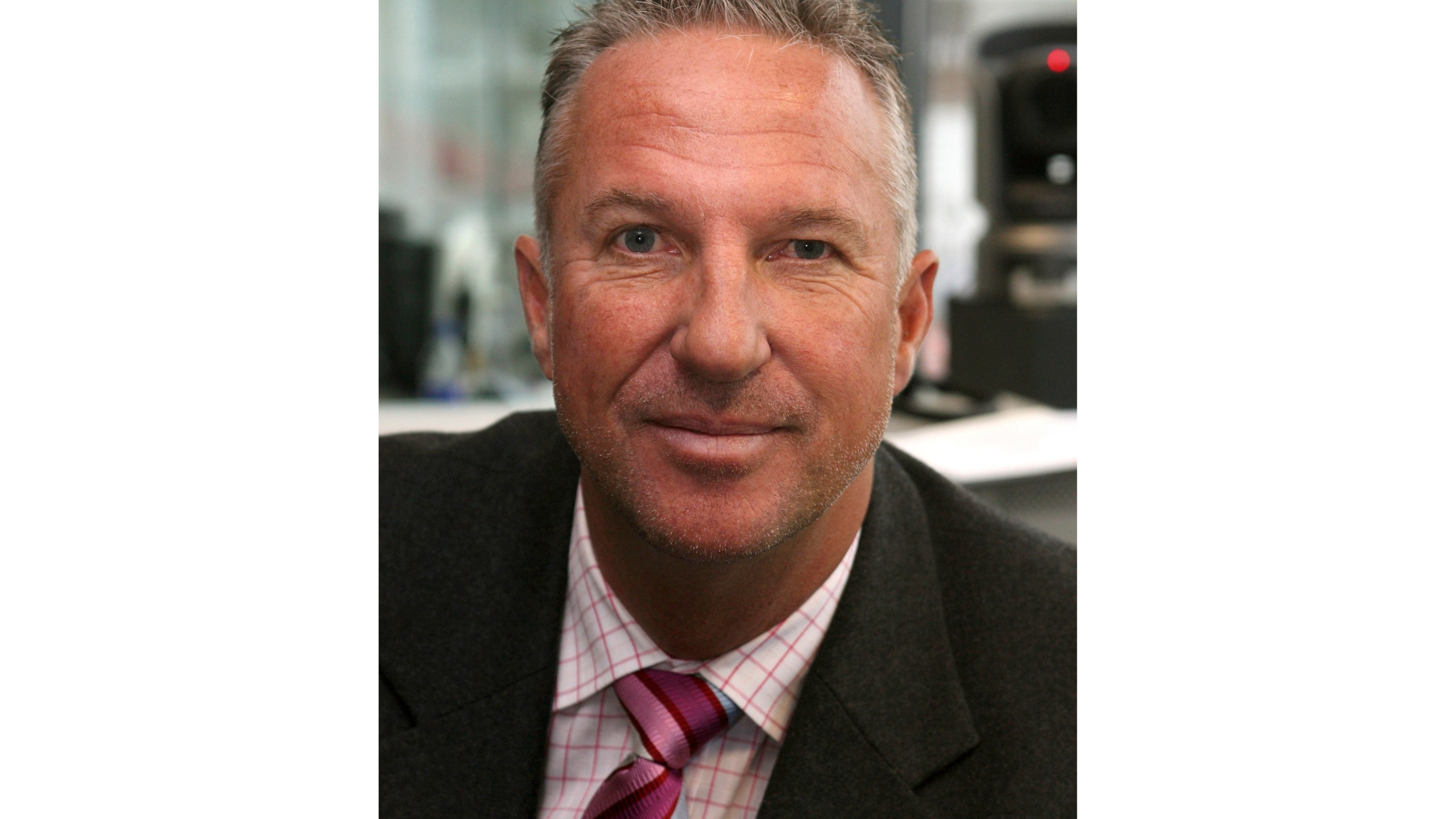 FILE - Former England cricketer Ian Botham prepares to commentate on the first day of England's fourth Test match of their four Test series against the West Indies in Durham, England on June 15, 2007 (AP Photo/Jon Super, File)