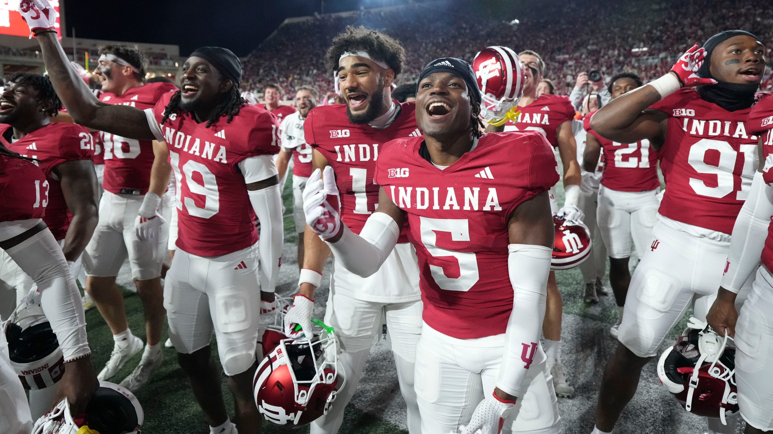 Indiana players celebrate after defeating Michigan in an NCAA college football game in Bloomington, Ind., Saturday, Nov. 9, 2024. (AP Photo/AJ Mast)