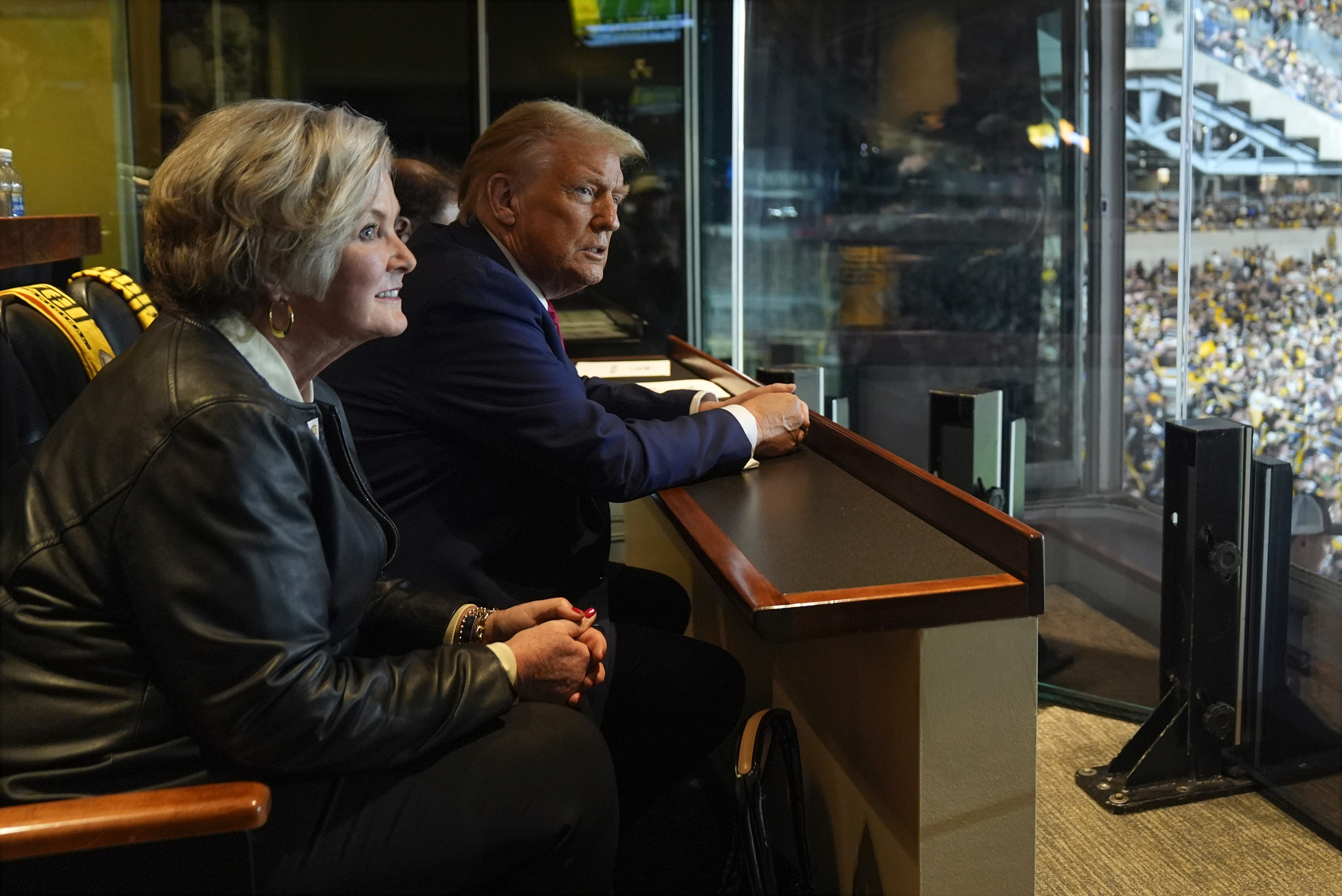 Republican presidential nominee former President Donald Trump sits with Susie Wiles as he attends the New York Jets football game against the Pittsburgh Steelers at Acrisure Stadium, Sunday, Oct. 20, 2024, in Pittsburgh. (AP Photo/Evan Vucci, Pool)