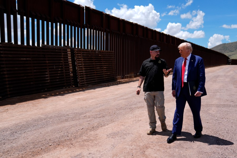 FILE - Republican presidential nominee former President Donald Trump listens to Paul Perez, president of the National Border Patrol Council, as he tours the southern border with Mexico, on Aug. 22, 2024, in Sierra Vista, Ariz. (AP Photo/Evan Vucci)