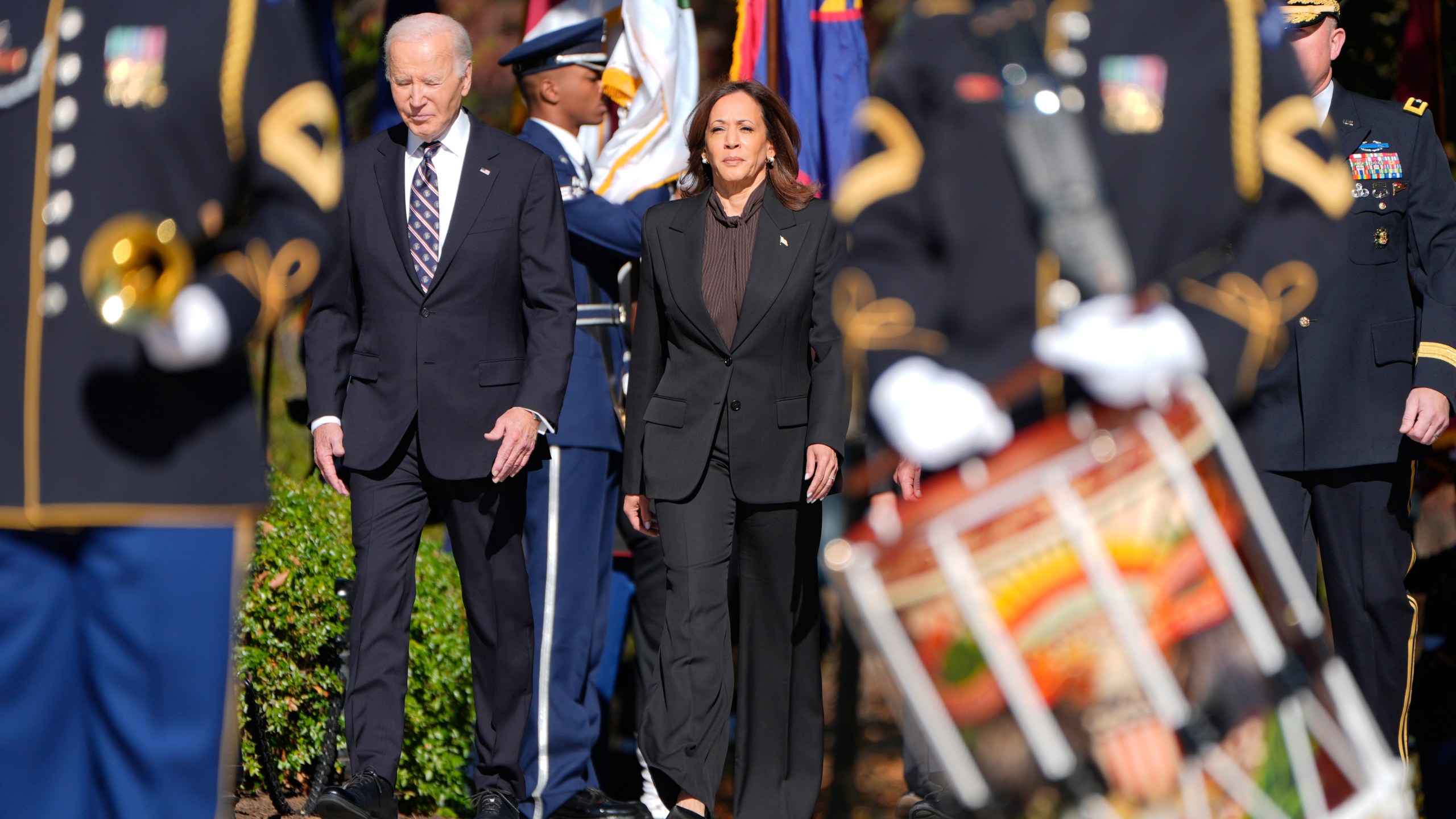 President Joe Biden, left, and Vice President Kamala Harris arrive at a wreath laying ceremony at the Tomb of the Unknown Soldier on National Veterans Day Observance at Arlington National Cemetery in Arlington, Va., Monday, Nov. 11, 2024. (AP Photo/Mark Schiefelbein)