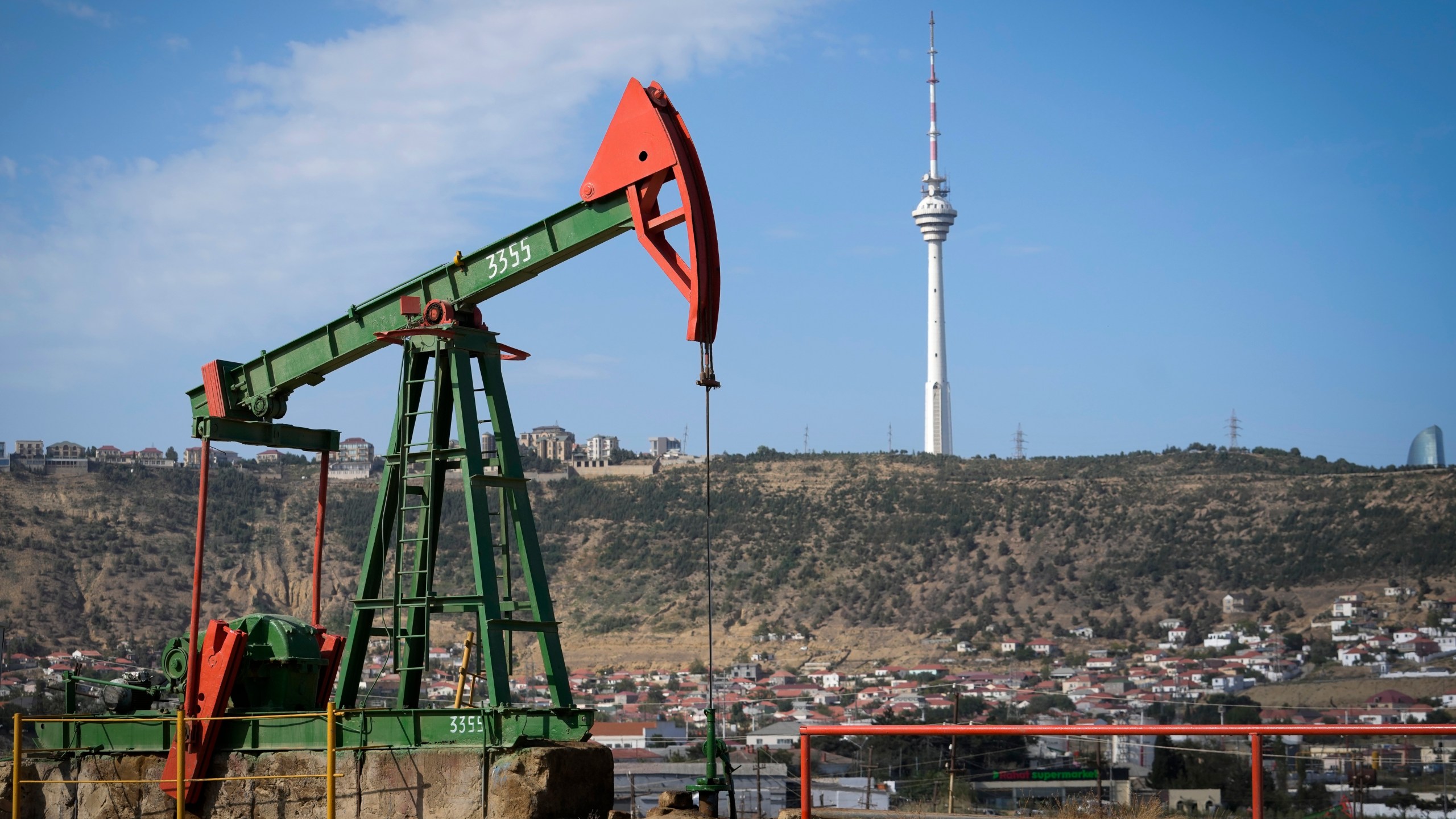 A pumpjack operates at a drilling site in Baku, Azerbaijan, Monday, Sept. 16, 2024. (AP Photo/Sergei Grits)