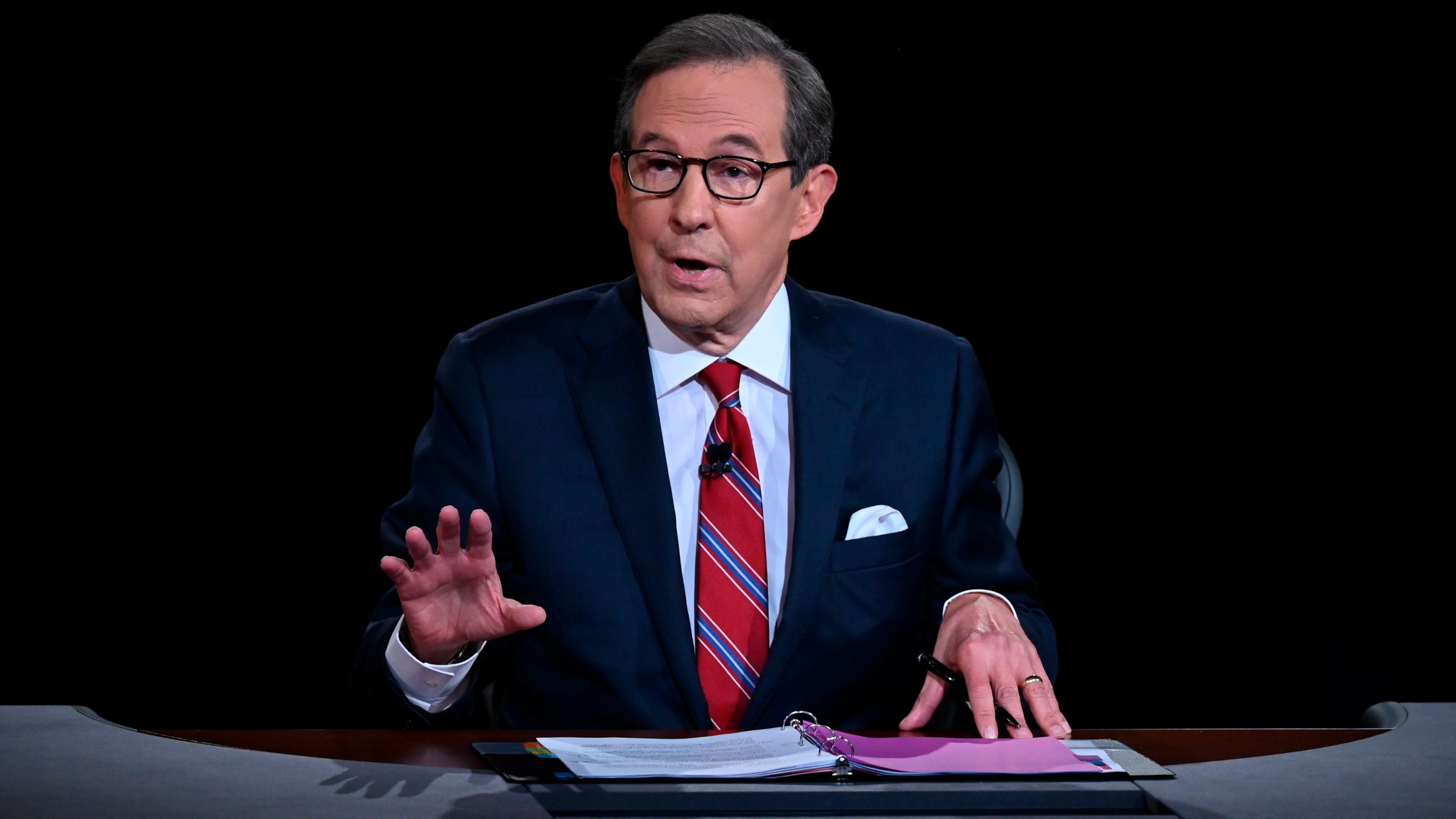 FILE - Moderator Chris Wallace speaks as President Donald Trump and Democratic presidential candidate former Vice President Joe Biden participate in the first presidential debate in Cleveland on Sept. 29, 2020. (Olivier Douliery/Pool via AP, File)