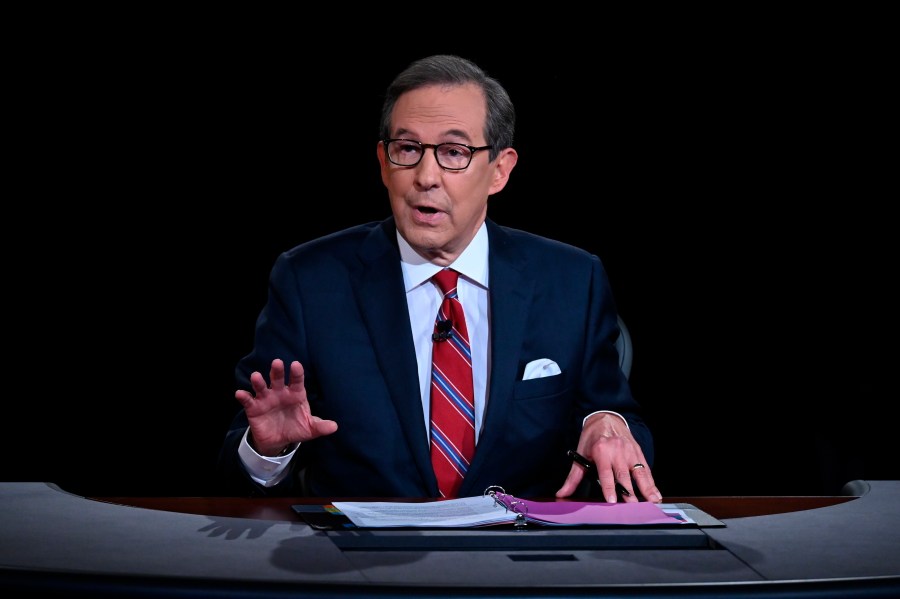 FILE - Moderator Chris Wallace speaks as President Donald Trump and Democratic presidential candidate former Vice President Joe Biden participate in the first presidential debate in Cleveland on Sept. 29, 2020. (Olivier Douliery/Pool via AP, File)