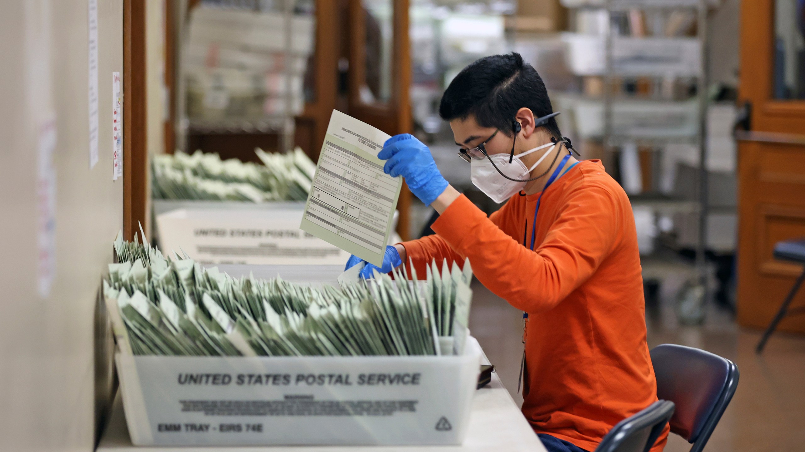 Andrew Chen sorts ballots at San Francisco Department of Elections in City Hall in San Francisco on Wednesday, Nov. 6, 2024. (Scott Strazzante/San Francisco Chronicle via AP)