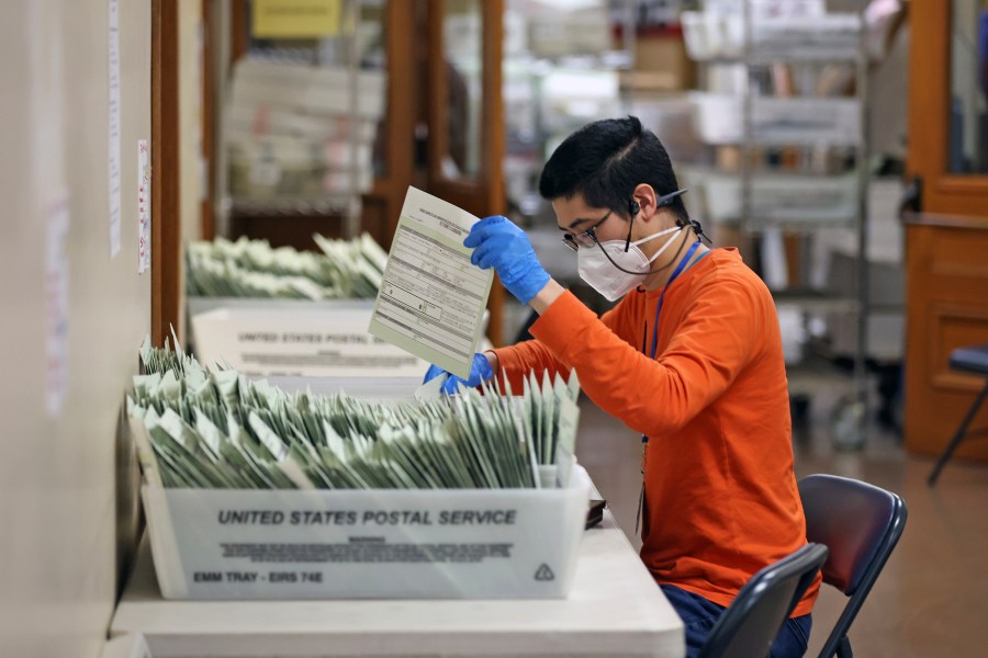 Andrew Chen sorts ballots at San Francisco Department of Elections in City Hall in San Francisco on Wednesday, Nov. 6, 2024. (Scott Strazzante/San Francisco Chronicle via AP)