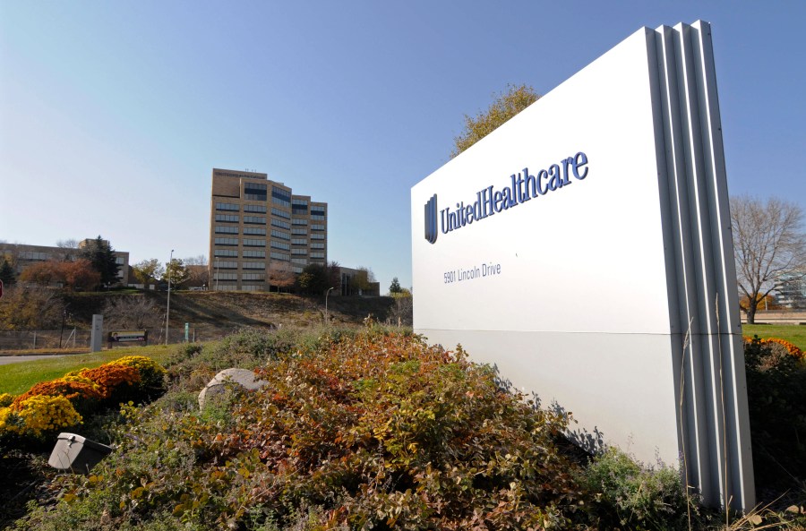 FILE - A sign stands on UnitedHealth Group Inc.'s campus in Minnetonka, Minn., Oct. 16, 2012. (AP Photo/Jim Mone, File)