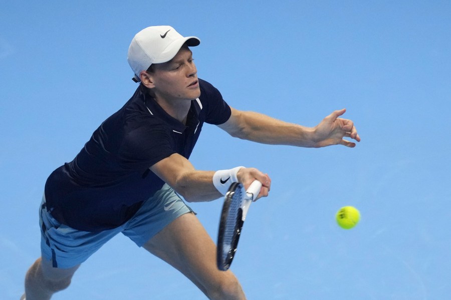 Italy's Jannik Sinner returns the ball to United States' Taylor Fritz during their singles tennis match of the ATP World Tour Finals at the Inalpi Arena, in Turin, Italy, Tuesday, Nov. 12, 2024. (AP Photo/Antonio Calanni)