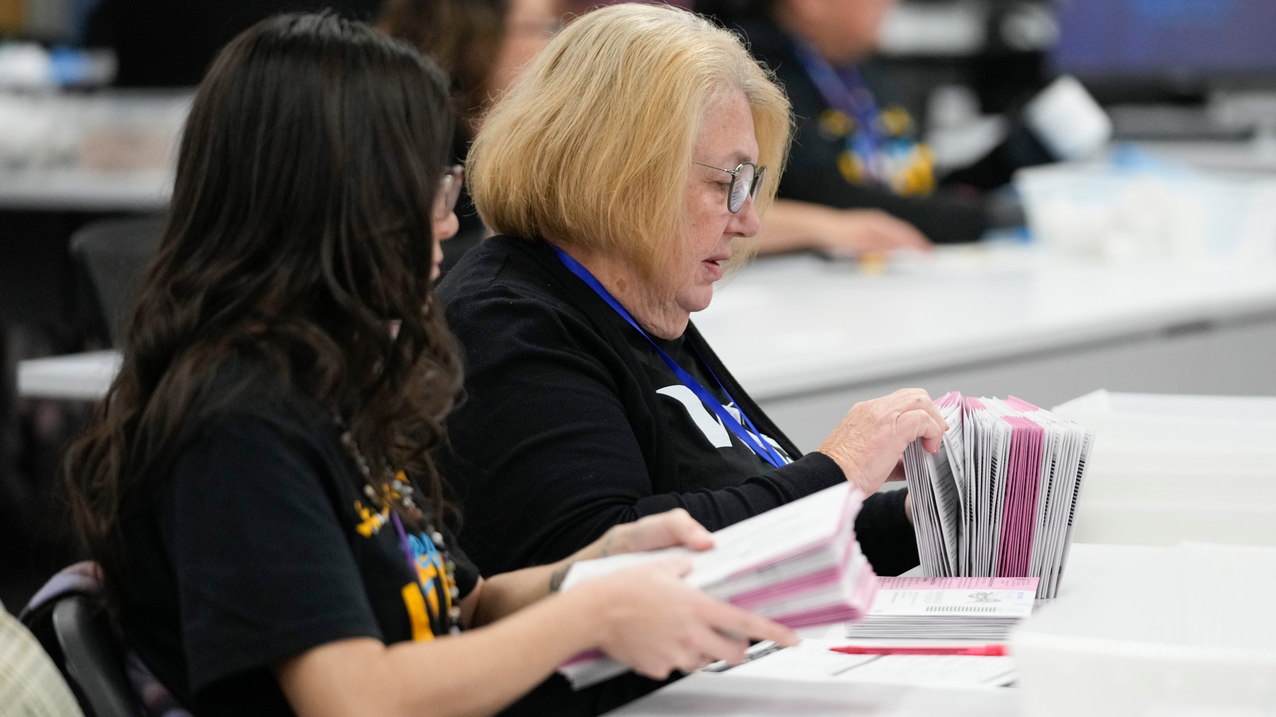 Election workers process ballots at the Washoe County Registrar of Voters Office, Tuesday, Nov. 5, 2024, in Reno, Nev. (AP Photo/Godofredo A. Vásquez)