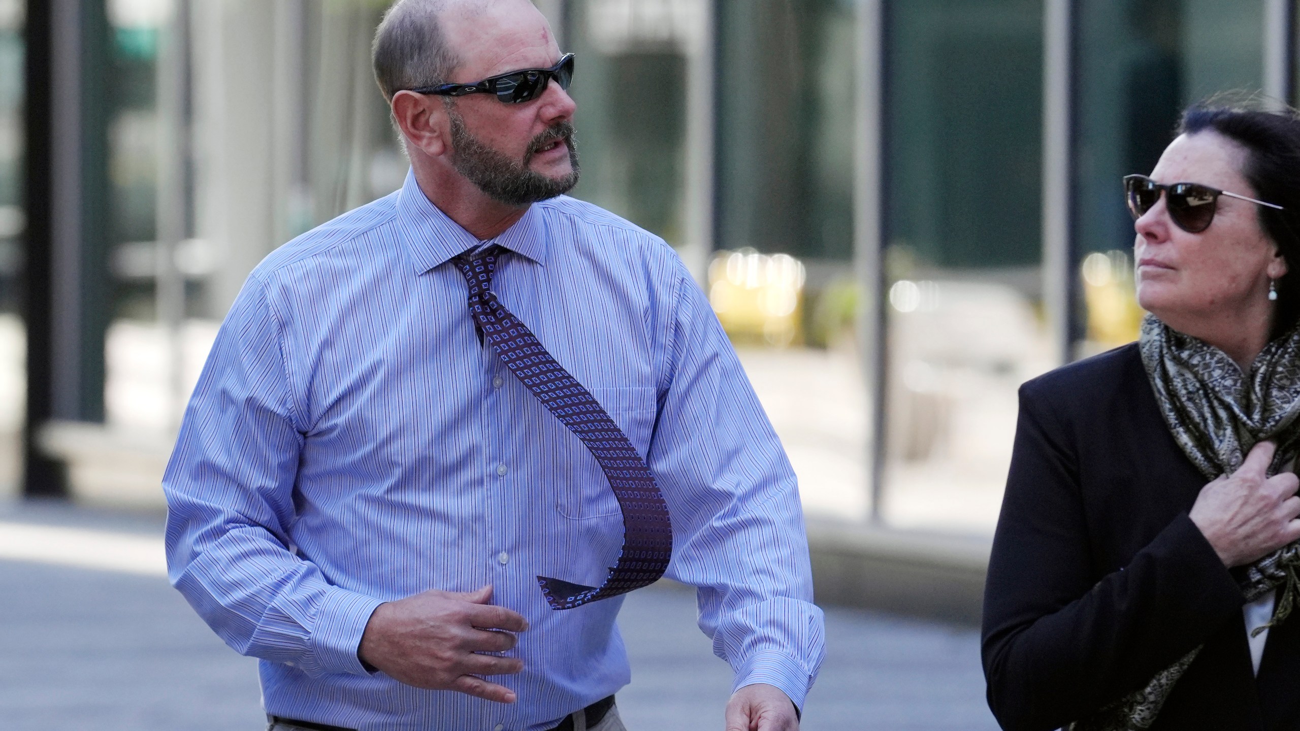 Jack Michael Teixeira, center, father of Massachusetts Air National Guardsman Jack Teixeira. arrives at federal court for his son's sentencing hearing, Tuesday, Nov. 12, 2024, in Boston,. (AP Photo/Steven Senne)