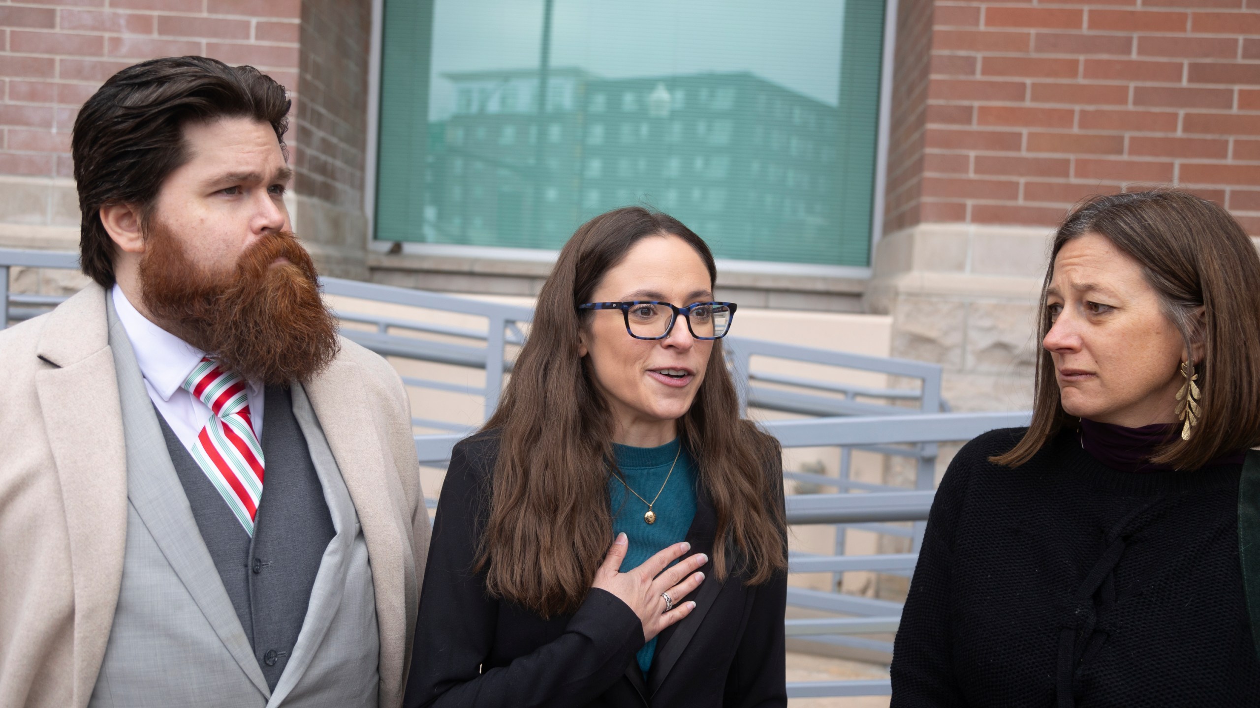 FILE - John Adkins, left to right, and his wife Jennifer, along with family physician Julie Lyons, talk to the media outside the Ada County Courthouse, Dec. 14, 2023, in Boise, Idaho. (AP Photo/Kyle Green, File)