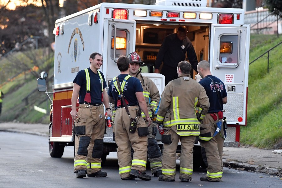 Members of the Louisville Fire Departments check their gear as they prepare to enter Givaudan Sense Colour following an explosion at the facility in Louisville, Ky., Tuesday, Nov. 12, 2024. (AP Photo/Timothy D. Easley)