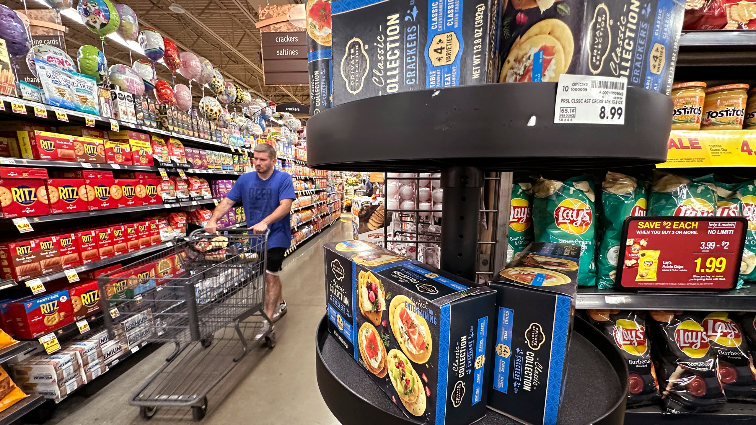 FILE - A customer shops at a grocery store in Chicago, Sept. 19, 2024. (AP Photo/Nam Y. Huh, File)